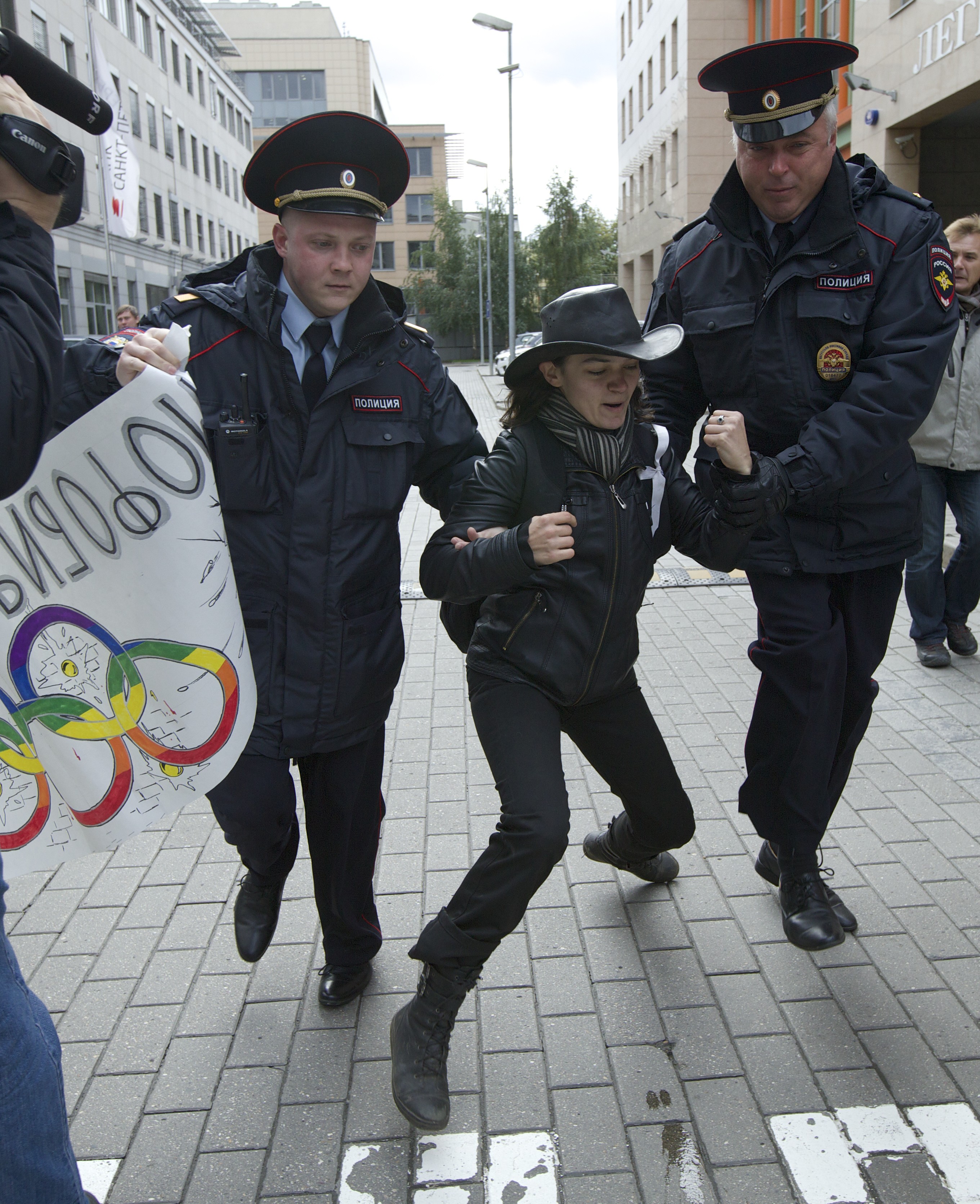 25 September 2013, Russia. Police arrest an LGBT rights activist during a protest outside the Sochi 2014 Winter Olympic Games Organising Committee office in Moscow.