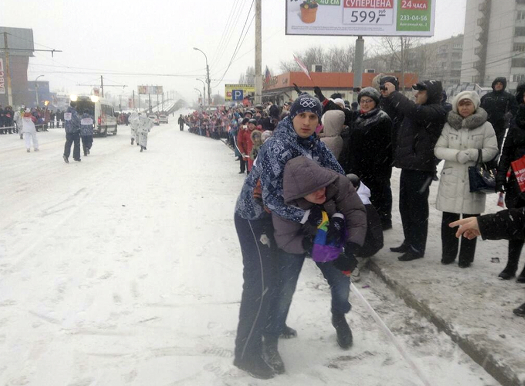 18 January 2014, Russia. Security personnel restrain a protester during the Olympic torch relay in the city of Voronezh.