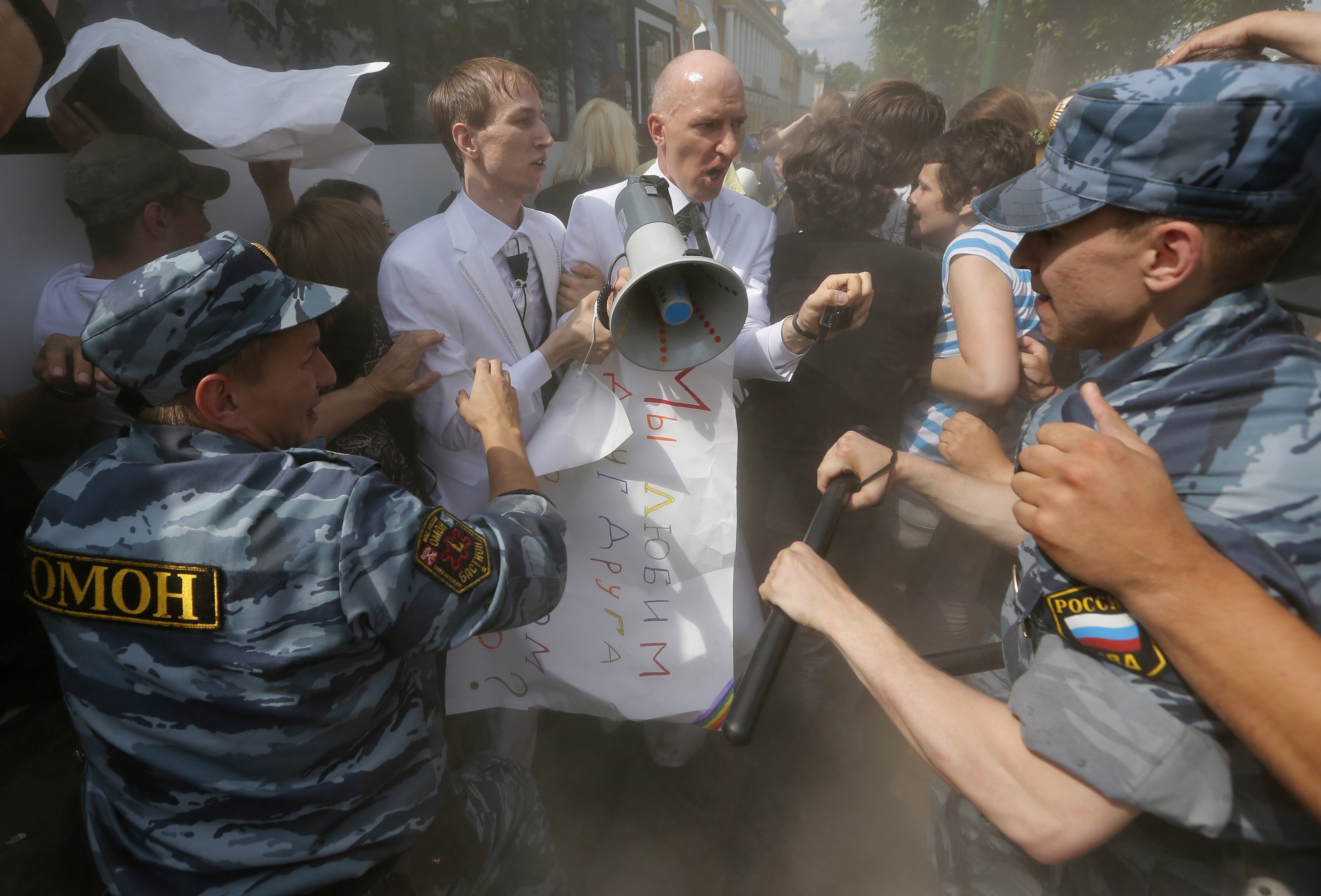 29 June 2013, Russia. Riot police detain Russian LGBT rights activists Maxim Lysak and Jury Gavrikov during a rally in St. Petersburg.