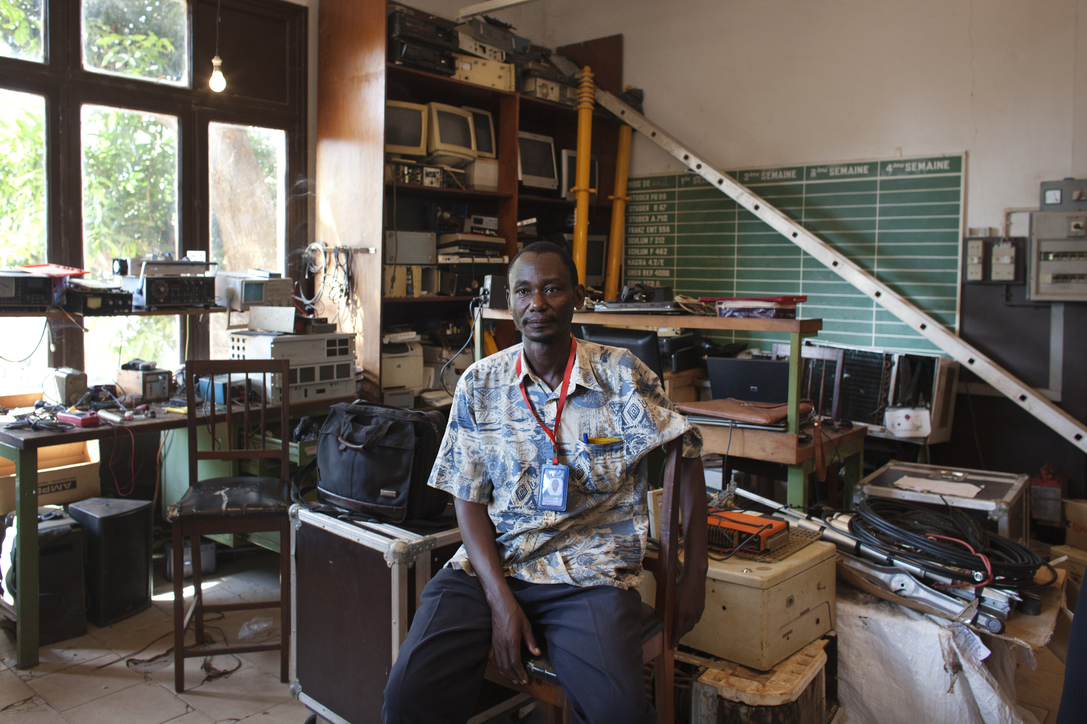 Yves Mbonzi Damanzi, a technician at the national radio station, poses for a picture in his office at the radio headquarters in Bangui, Central African Republic, November 28, 2013. The studio was looted for its computers and recording equipment during the March 2013 coup.