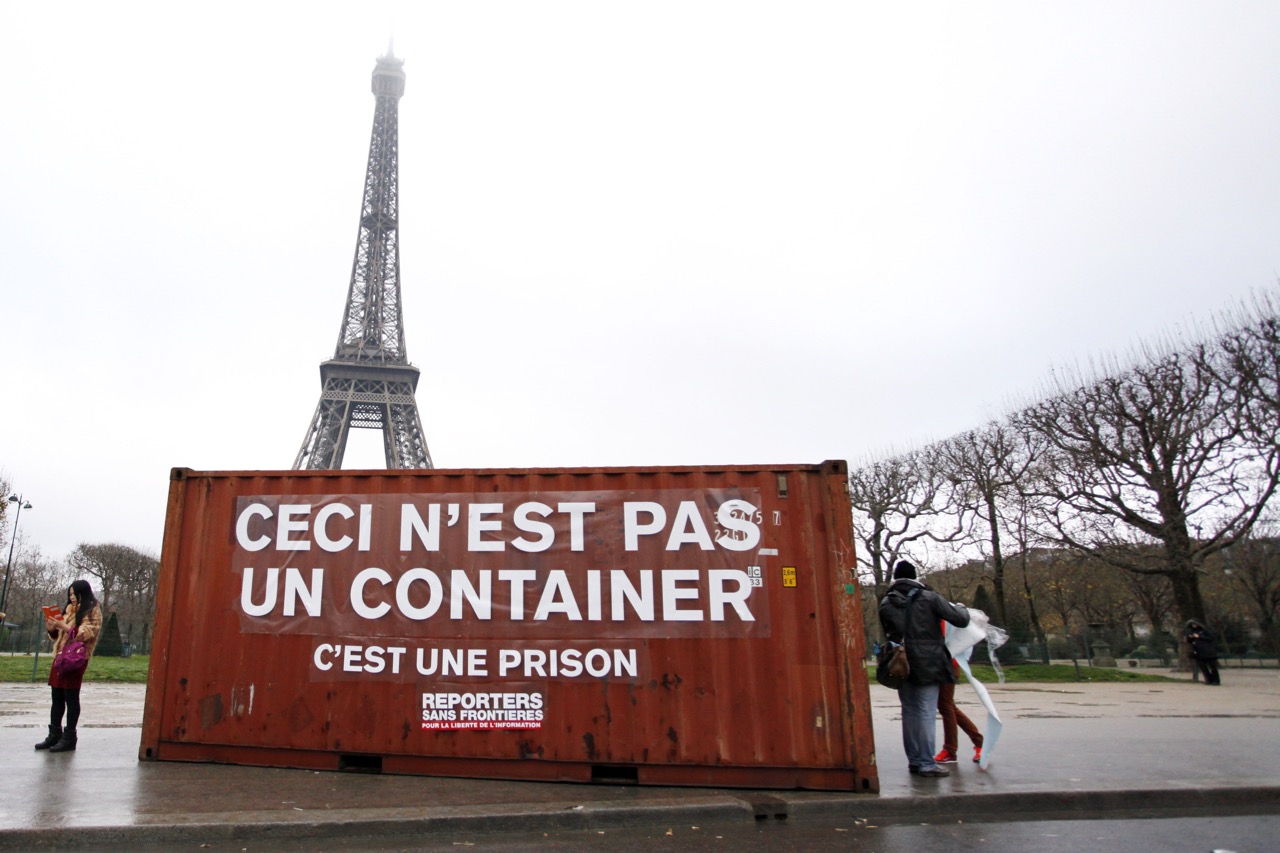 A shipping container bearing a sign which translates as 'This is not a container, it is a prison' is used in a demonstration by Reporters Without Borders, in Paris, France, 16 December 2014, in support of imprisoned journalists in Eritrea and elsewhere