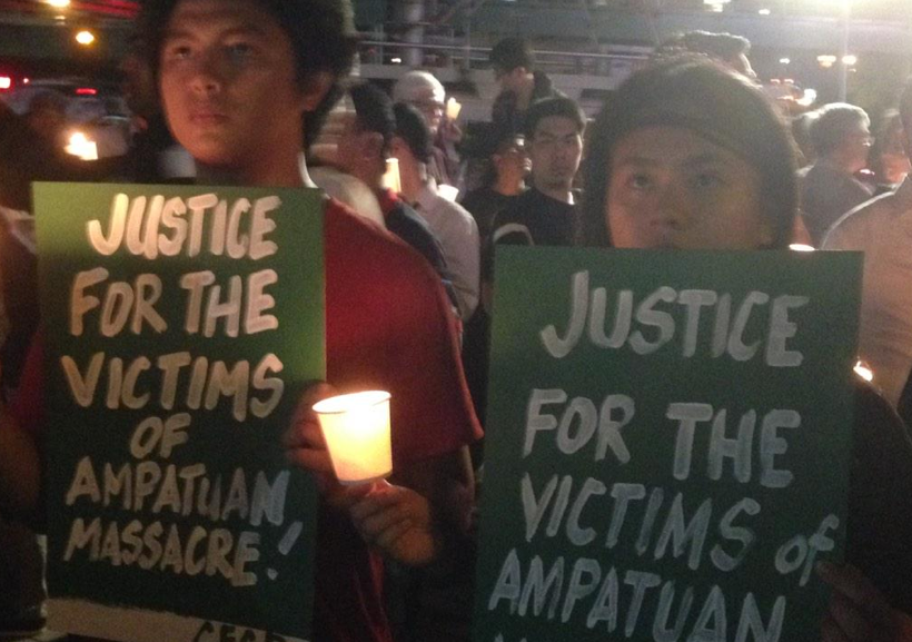 Individuos comparten llamados por justicia en la vigilia de velas en Manila el 23 de noviembre 2014