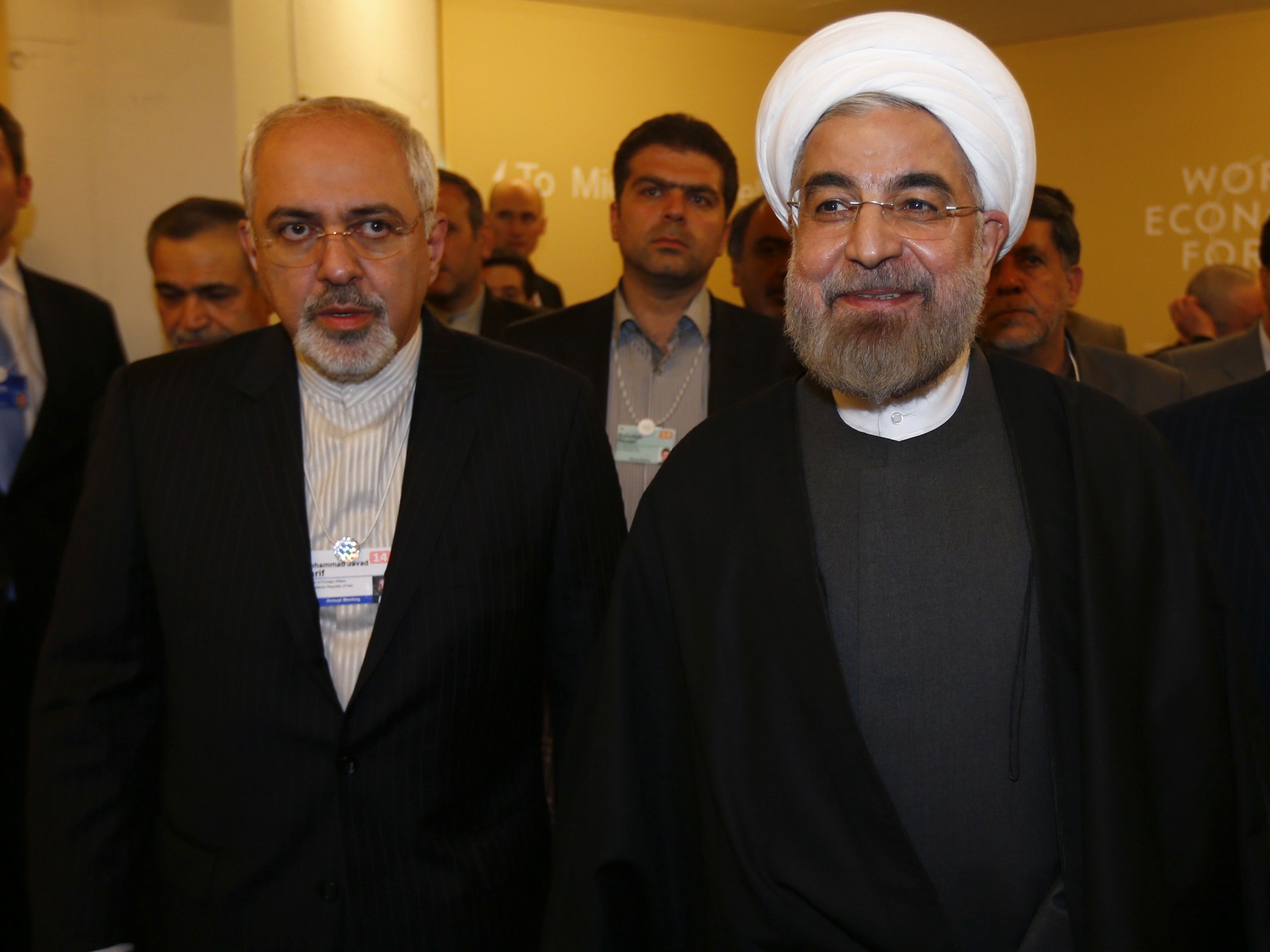 Iran's President Hassan Rouhani (R) and Iran's Foreign Minister Mohammad Javad Zarif 