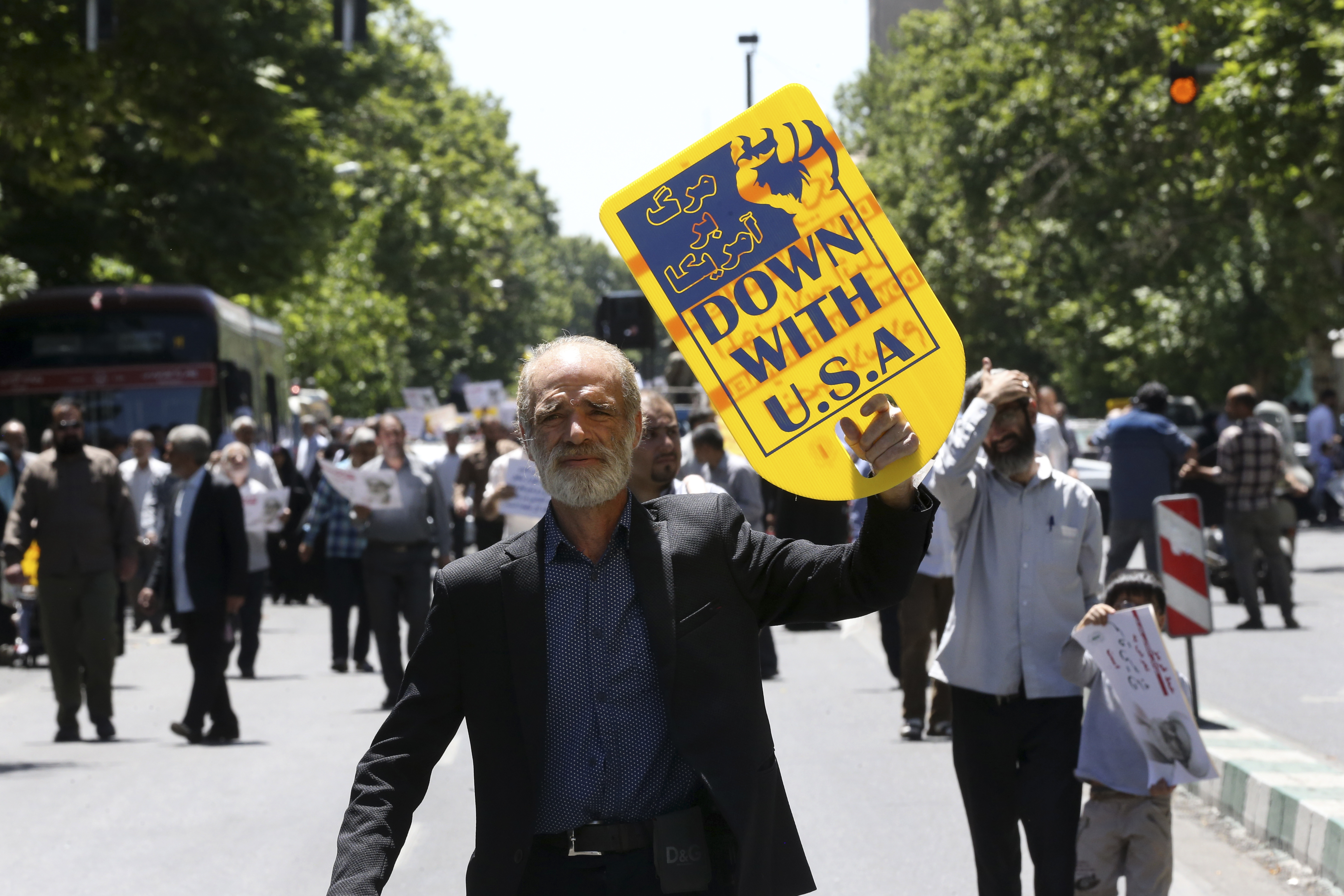 A man holds up an anti-U.S. placard during a protest against a Bahrain police raid on the hometown of Shiite cleric sheikh Isa Qassim, after Friday prayers in Tehran, Iran, 26 May 2017