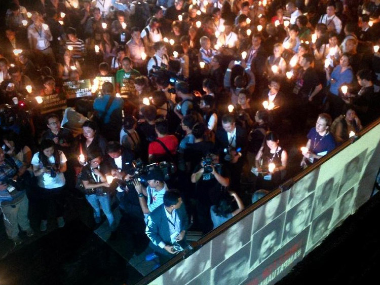 Individuals and media attended the candle vigil in EDSA Shrine in Quezon City, Manila on 23 November 2014 