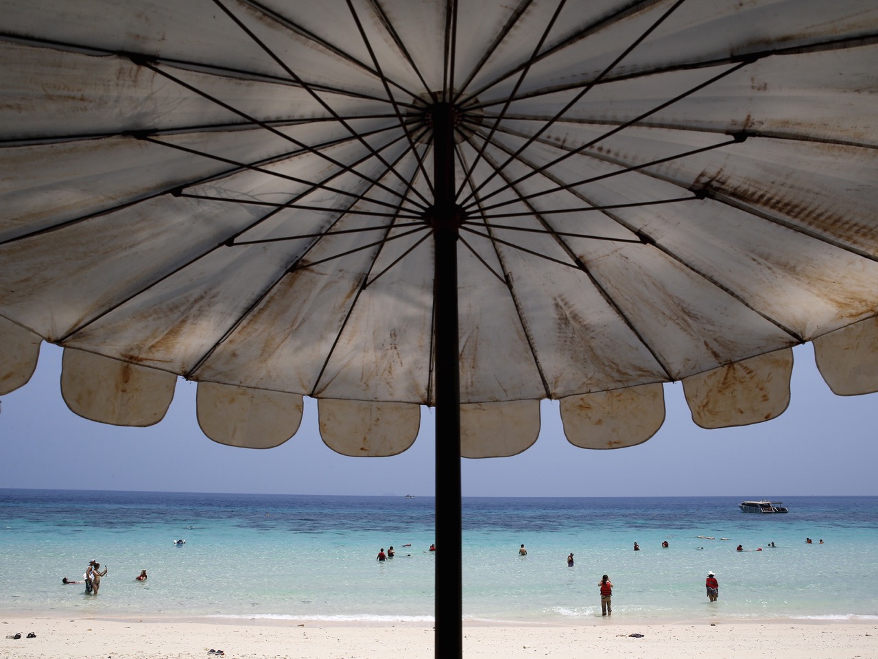 Tourists are seen on a beach of Maiton Island in Phuket, Thailand, 18 March 2016