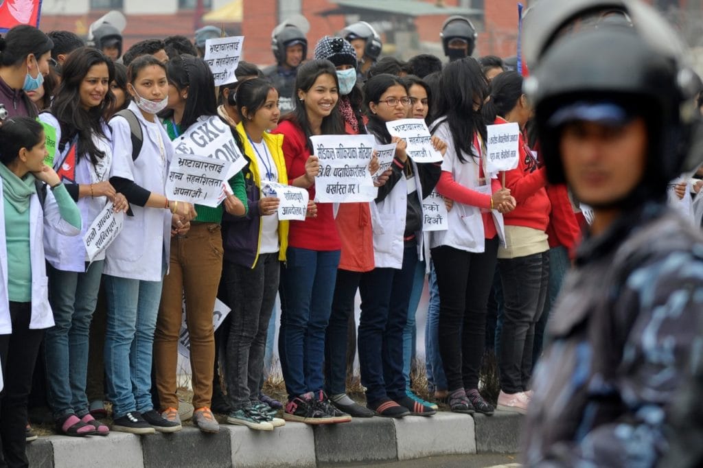 Activists take part in an anti-corruption protest condemning the actions of the government and political parties, in Kathmandu, Nepal, 14 February 2014, PRAKASH MATHEMA/AFP/Getty Images