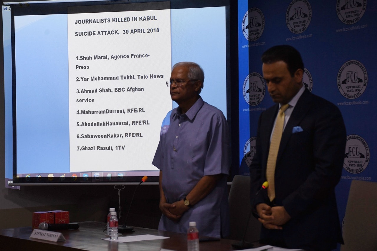 Afghanistan Ambassador to India Shaida Mohammad Abdali (R) and Foreign Correspondent's Club (FCC) President S. Venkat Narayan (L) pay tribute to Afghan journalists who were killed in a targeted suicide bombing, at the Foreign Correspondent's Club (FCC) in New Delhi, India, 4 May 2018, PRAKASH SINGH/AFP/Getty Images