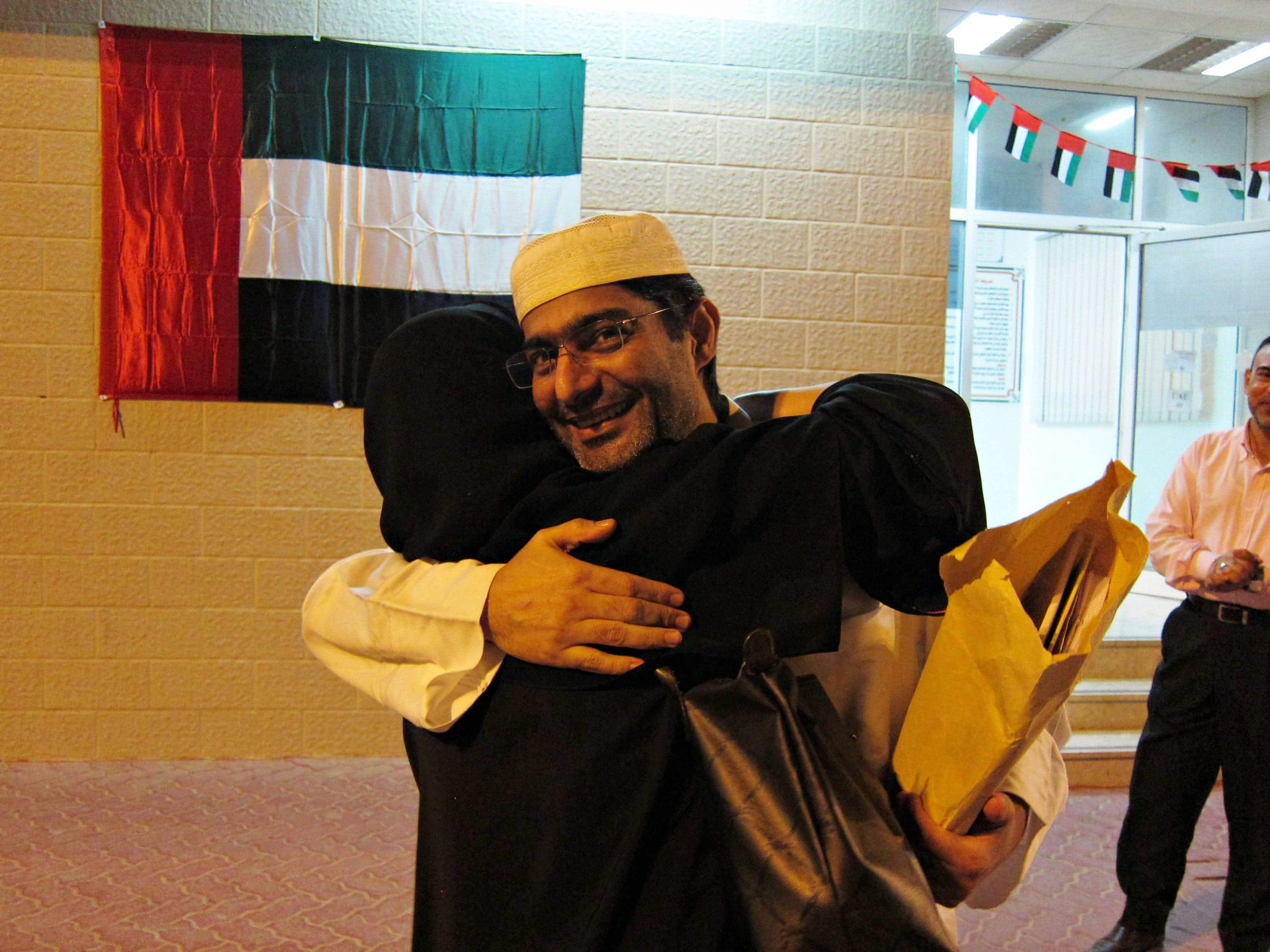 Human rights activist Ahmed Mansoor embracing his wife outside Al Wathba prison on 28 November 2011, after his prison sentence was commuted, © 2011 Samer Muscati/Human Rights Watch