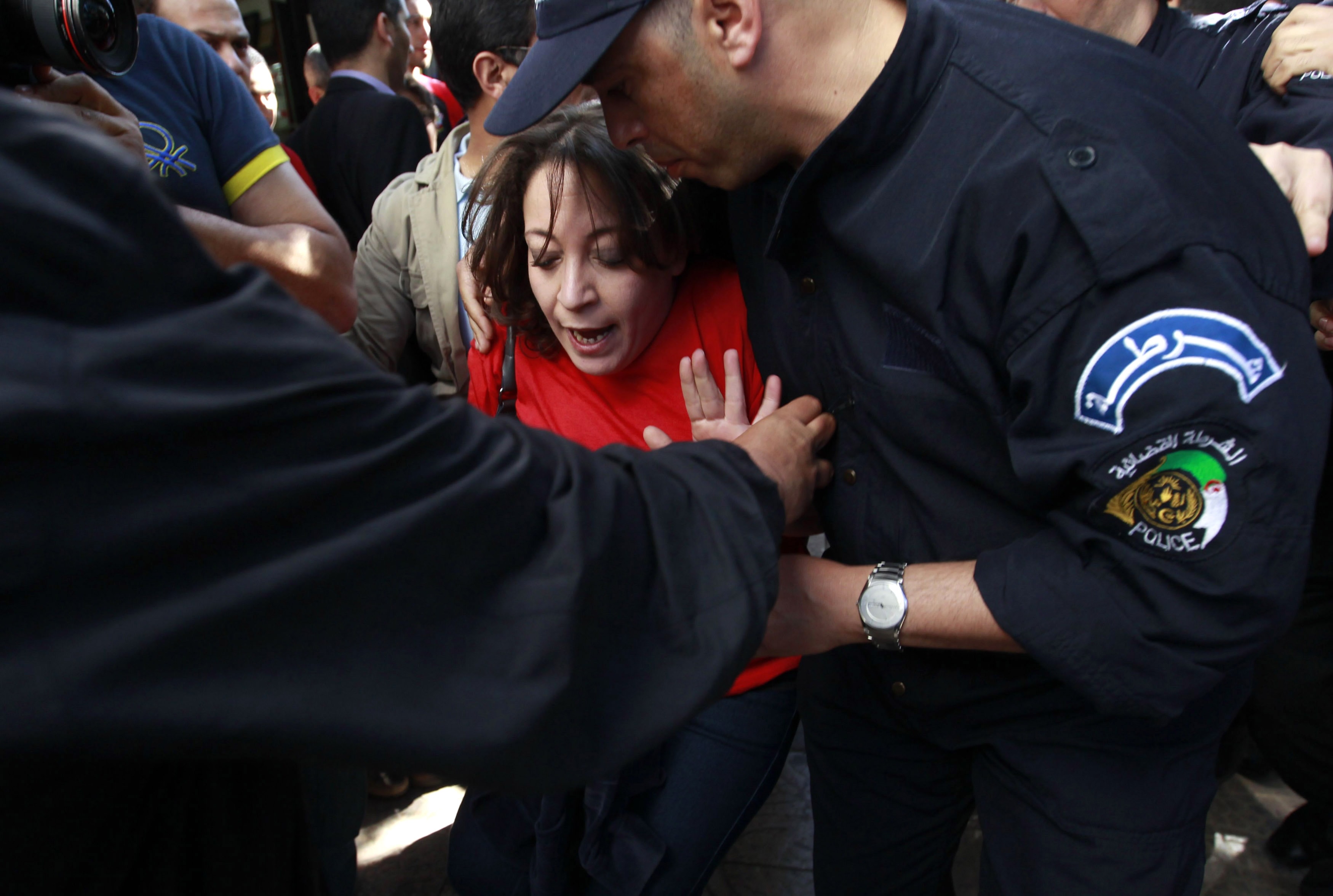 Police officers detain Amira Bouraoui leader of the "Barakat" (Enough) movement during a demonstration against election and Algerian President Abdulaziz Bouteflika's decision to run for a fourth term, in Algiers on 16 April 2014, REUTERS/Louafi Larbi
