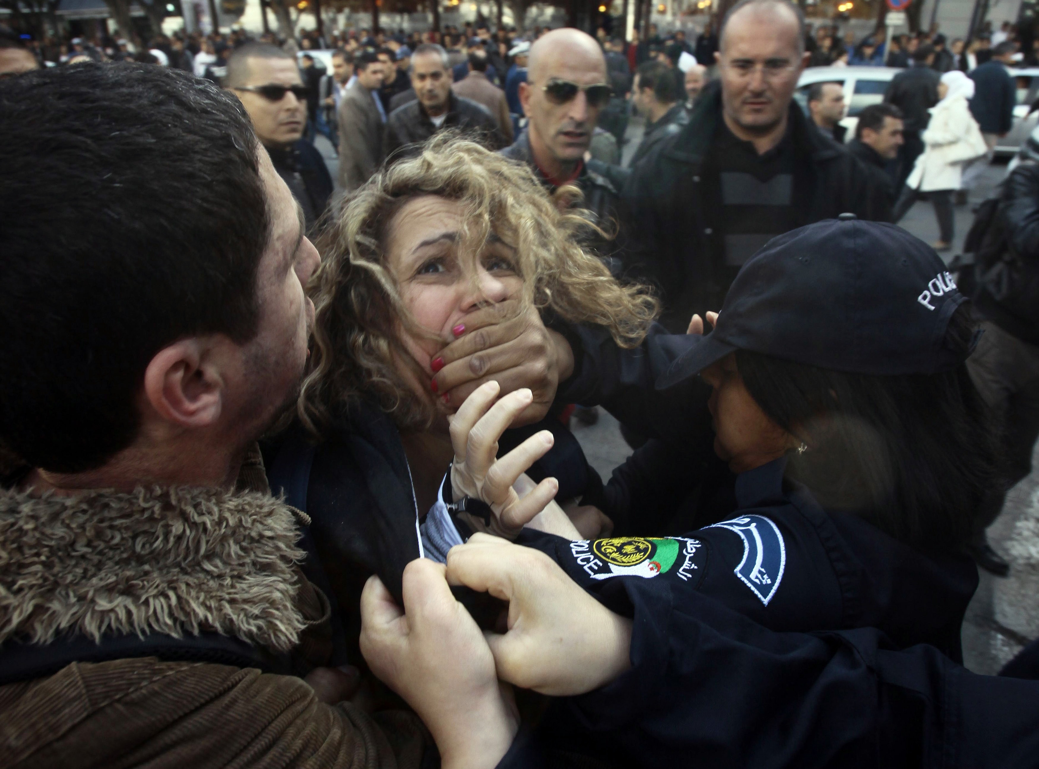Police detain a protester during a demonstration against Algerian President Abdulaziz Bouteflika's decision to run for a fourth term, in Algiers on 6 March 2014, REUTERS/Ramzi Boudina
