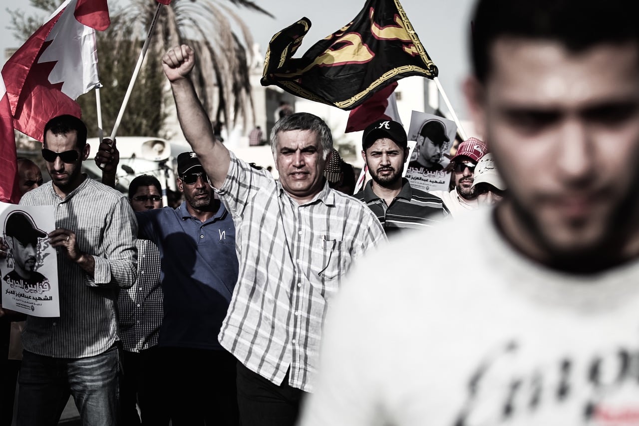 Human rights defender Nabeel Rajab takes part in the funeral of an activist in the village of Sanabis, Bahrain, 6 July 2014; the activist had been hit in the head by a tear gas canister and rubber bullets during a protest, NurPhoto/Corbis via Getty Images