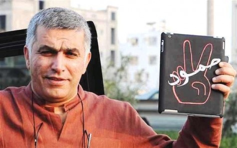 Bahrain rights defender Nabeel Rajab holds up a message of "resistance" earlier this year, BCHR