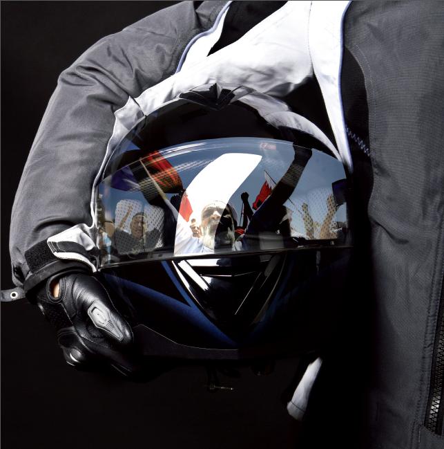 A campaign poster depicting Bahrain’s uprising as reflected in the helmet of a racing driver who is about to start the race, Reporters Without Borders