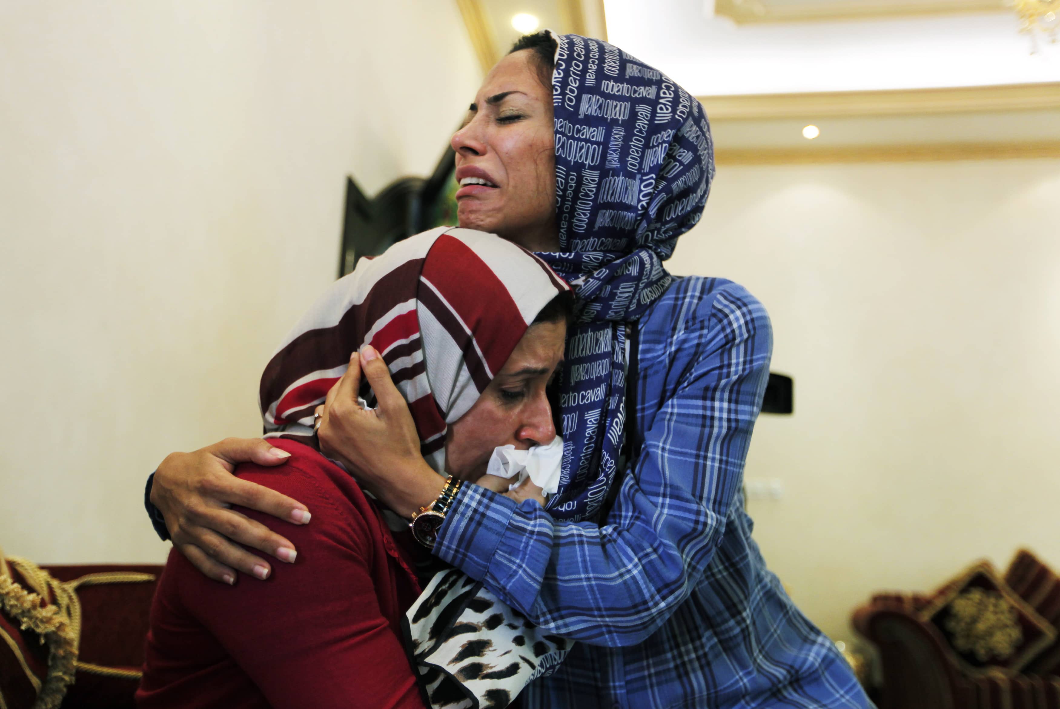 Dr. Fatima Haji hugs Dr. Zahra Ahmad al-Sammak, after hearing the verdicts announced by a Bahraini appeals court in Bahrain on 14 June 2012. The court upheld convictions of ten medical personnel based on their participation in pro-democracy protests, REUTERS/Hamad I Mohammed