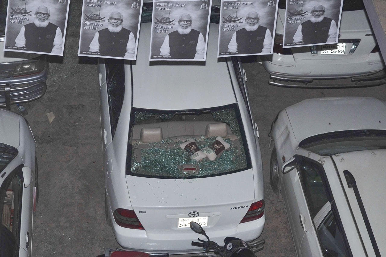 The damaged car of a journalist is seen after the attack by a group of baton-wielding assailants in Nawabganj town near Dhaka, Bangladesh, 24 December 2018, -/AFP/Getty Images