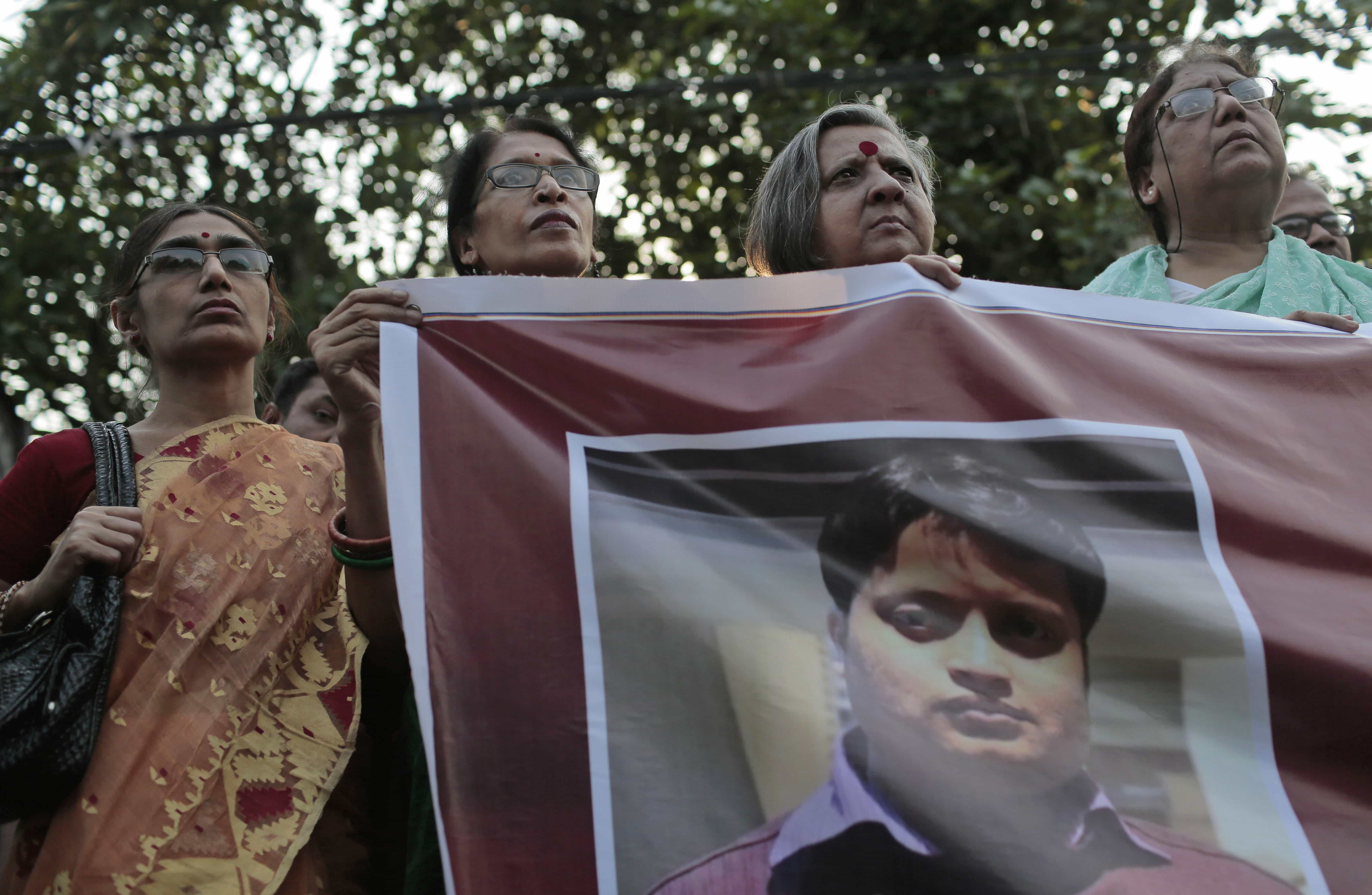 Activists hold a banner displaying a portrait of blogger and author Ananta Bijoy Das during a protest against his killing, in Dhaka, 12 May 2015, AP Photo/A.M. Ahad