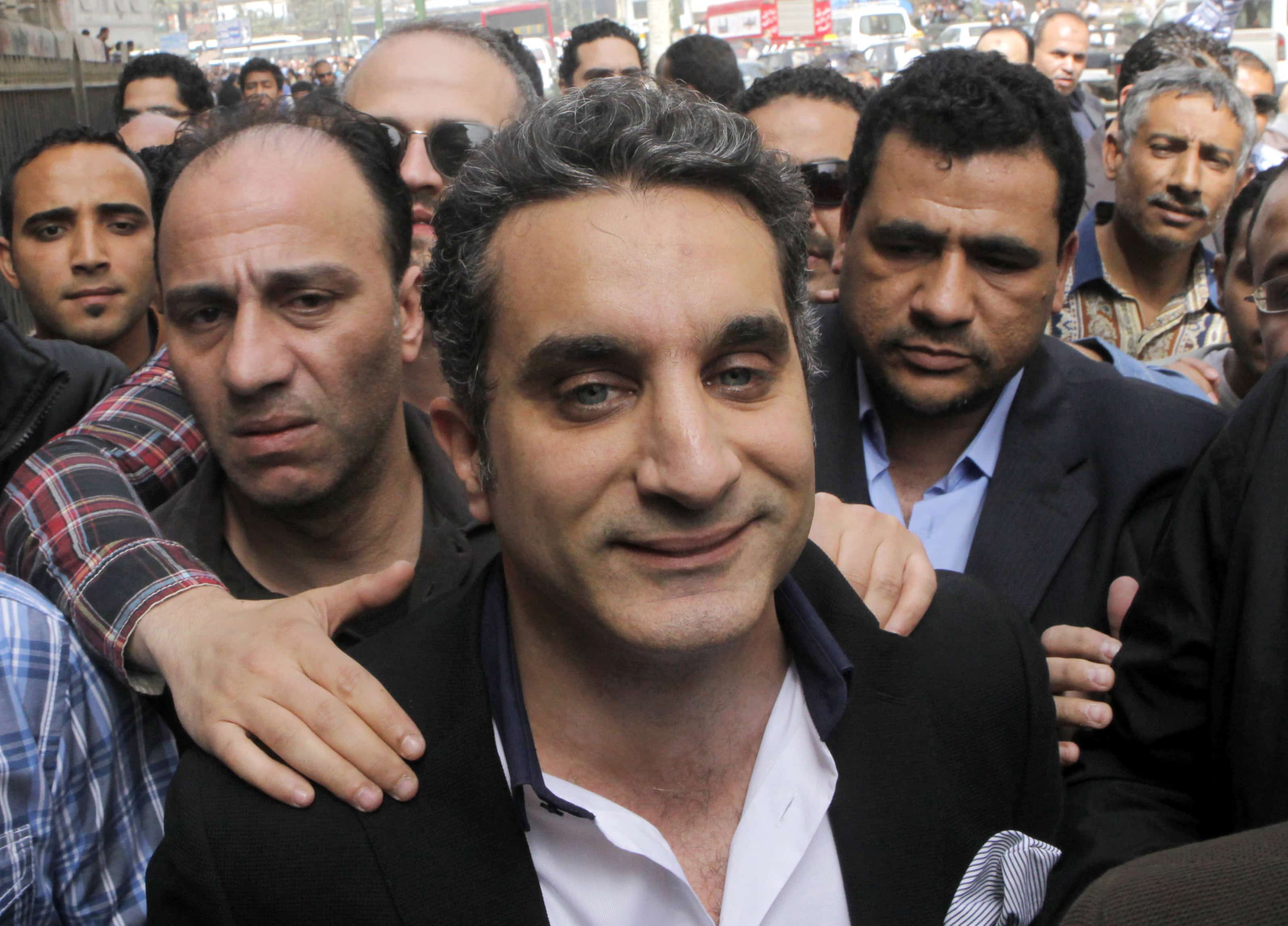 Bassem Youssef enters the state prosecutors' office to face accusations of insulting Islam and the president, AP Photo/Amr Nabil