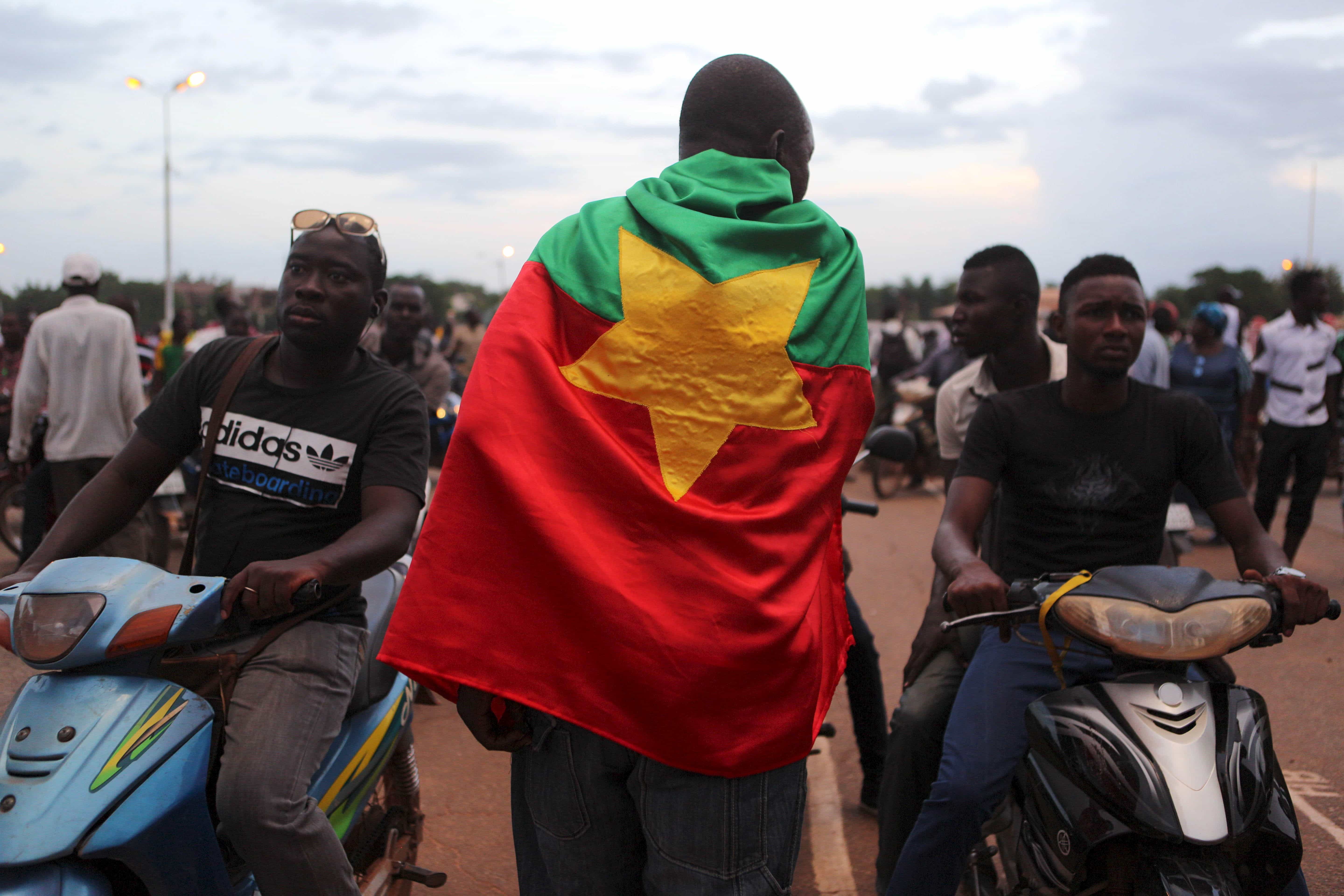 A protester wearing a Burkina Faso flag attends a protest in Ouagadougou, 16 September 2015, REUTERS/Joe Penney