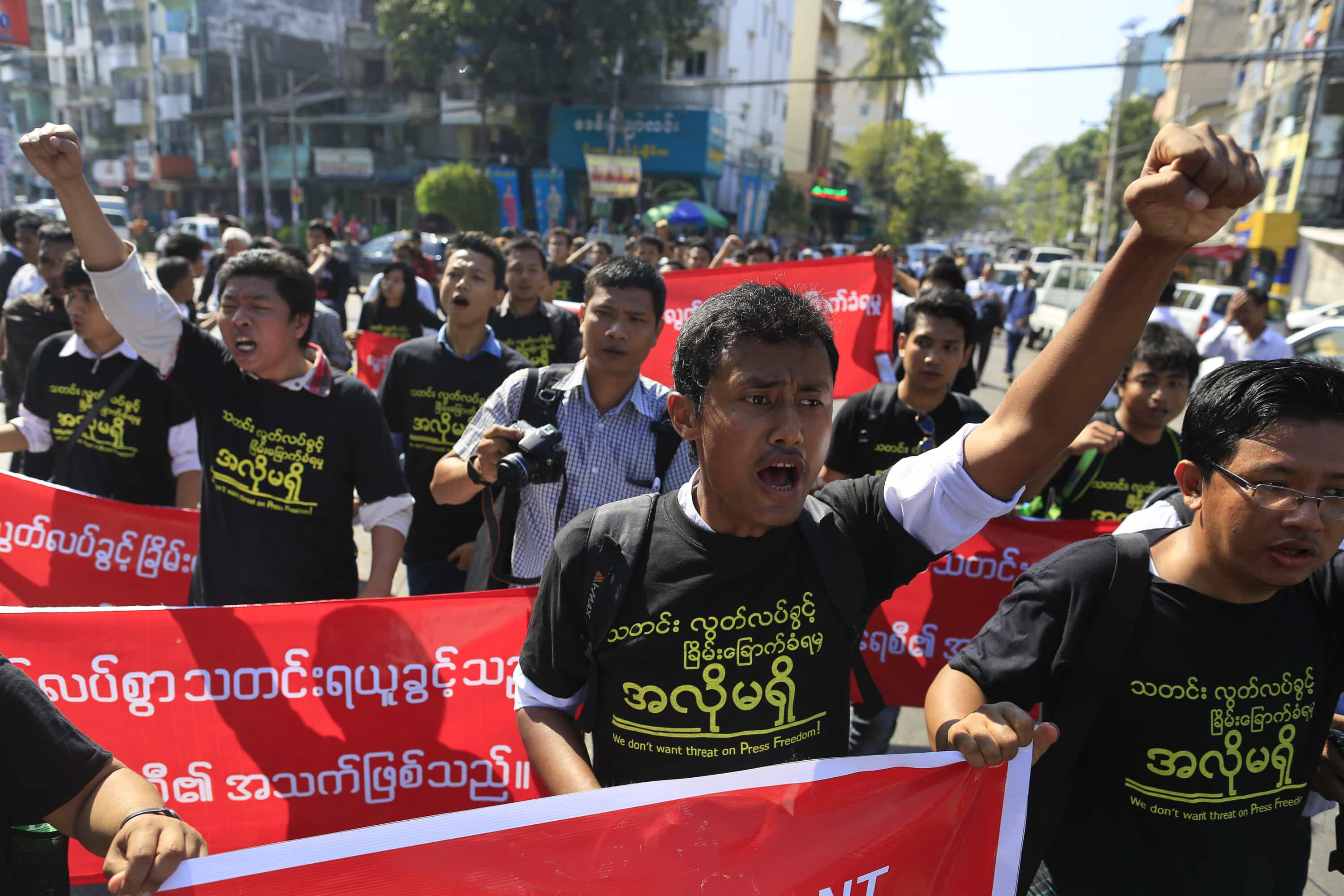 Reporters shout as they march to demonstrate for press freedom in Yangon, 7 January 7, 2014, after a journalist was sentenced on defamation charges, REUTERS/Soe Zeya Tun