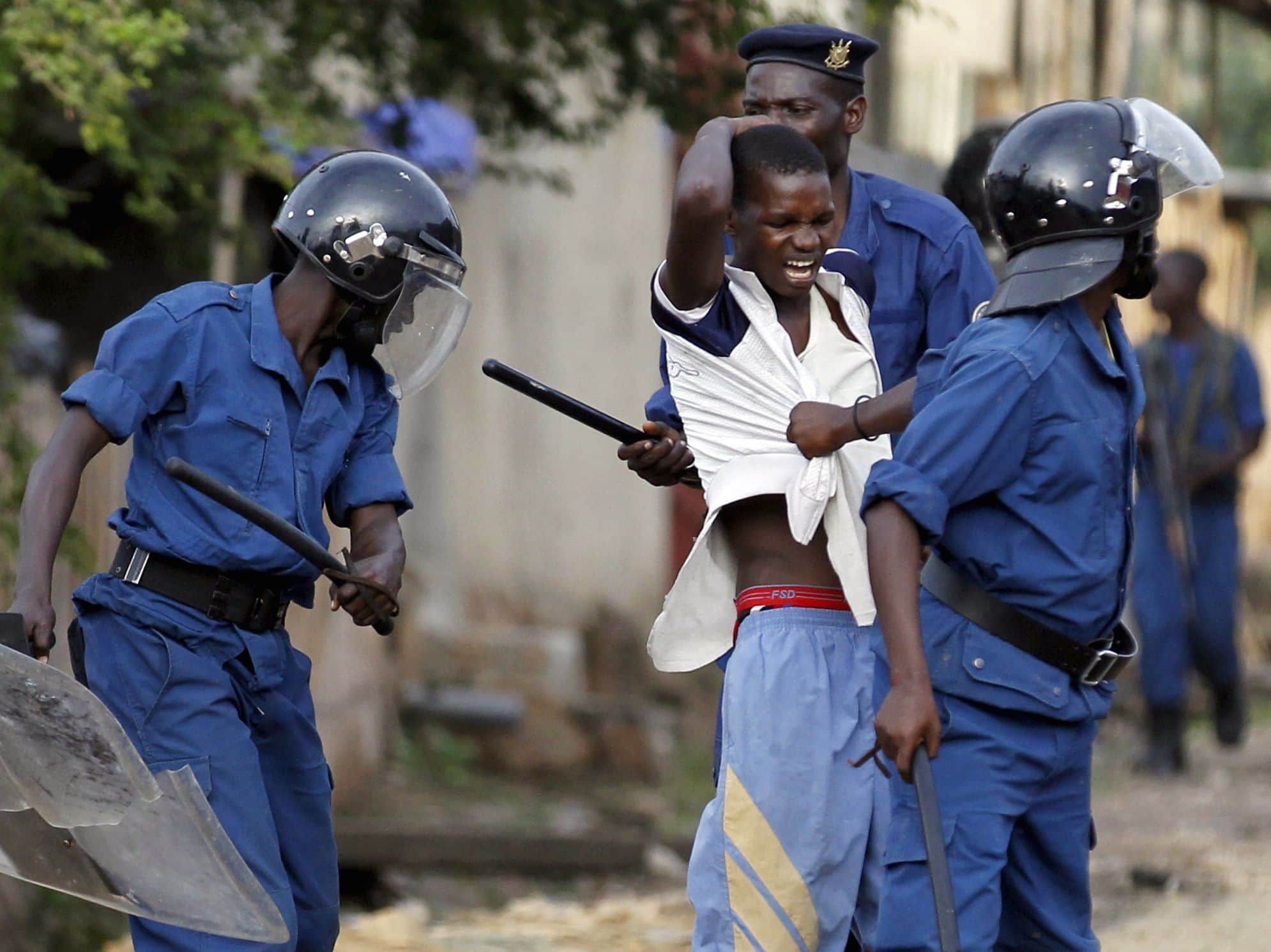 Riot police detain a resident participating in street protests in Bujumbura, 26 April 2015, REUTERS/Thomas Mukoya