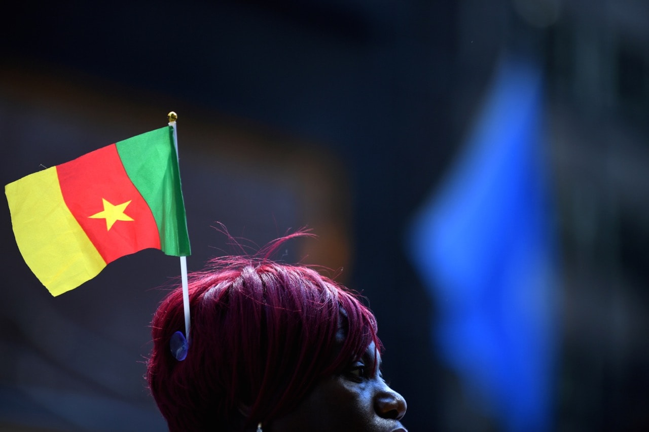 A supporter of Cameroon President Paul Biya waits for him to depart the Palace Hotel to address the 72nd United Nations General Assembly in New York, U.S., 22 September 2017, REUTERS/Darren Ornitz