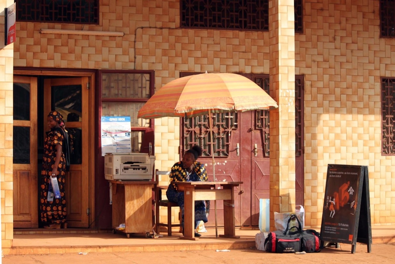 A women-run mini office with a printer and mobile phones, in Bafoussam, Cameroon, 12 January 2011, Carsten ten Brink/Flickr, Attribution-NonCommercial-NoDerivs 2.0 Generic (CC BY-NC-ND 2.0)