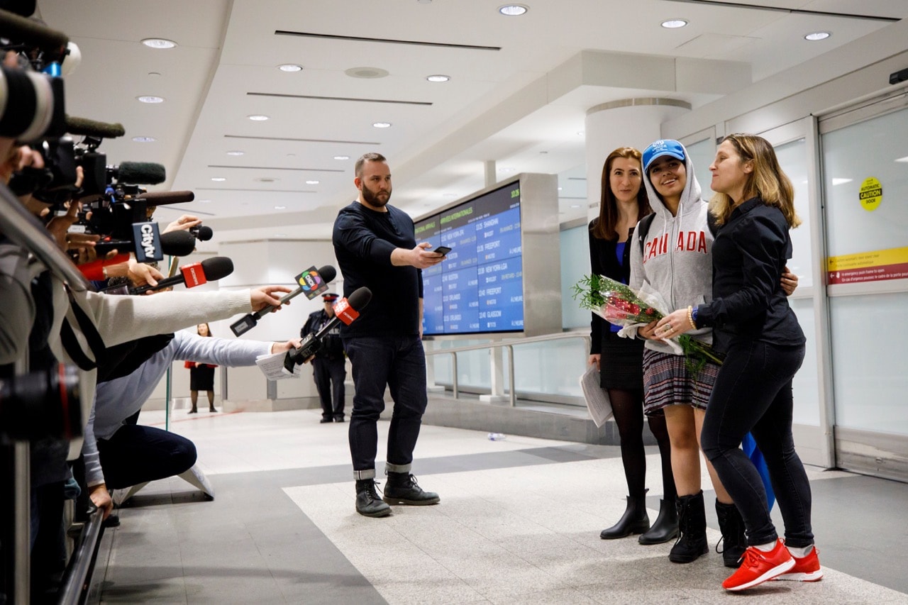 Saudi asylum seeker Rahaf Mohammed al-Qunun smiles as she is introduced to the media at Toronto Pearson International Airport, 12 January 2019, Cole Burston/Getty Images