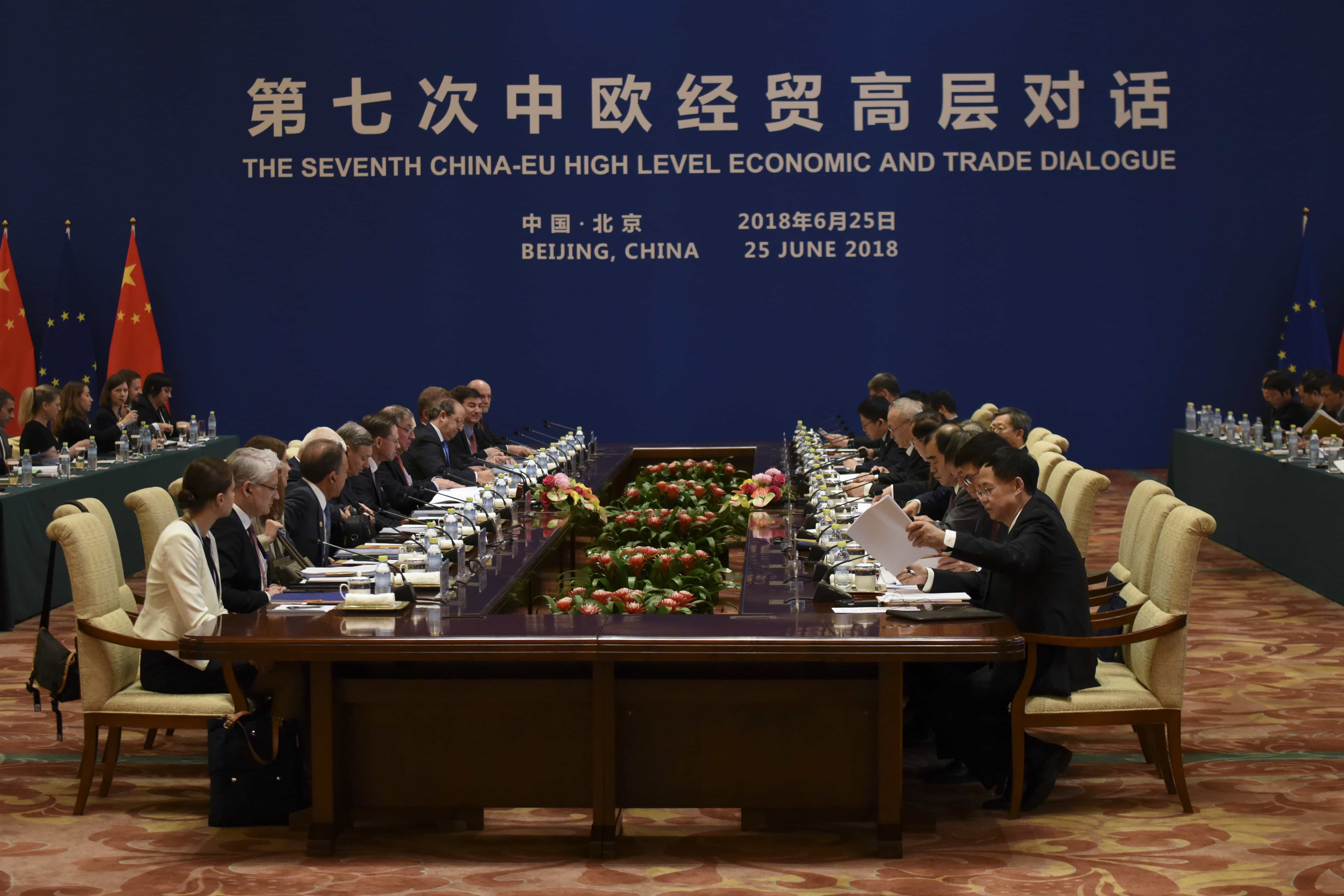 European Commission Vice-President Jyrki Katainen (7th L) speaks to Chinese Vice Premier Liu He (7th R, white hair) at their meeting during the EU-China High-level Economic Dialogue at the Diaoyutai State Guesthouse in Beijing, 25 June 2018, WANG ZHAO/AFP/Getty Images