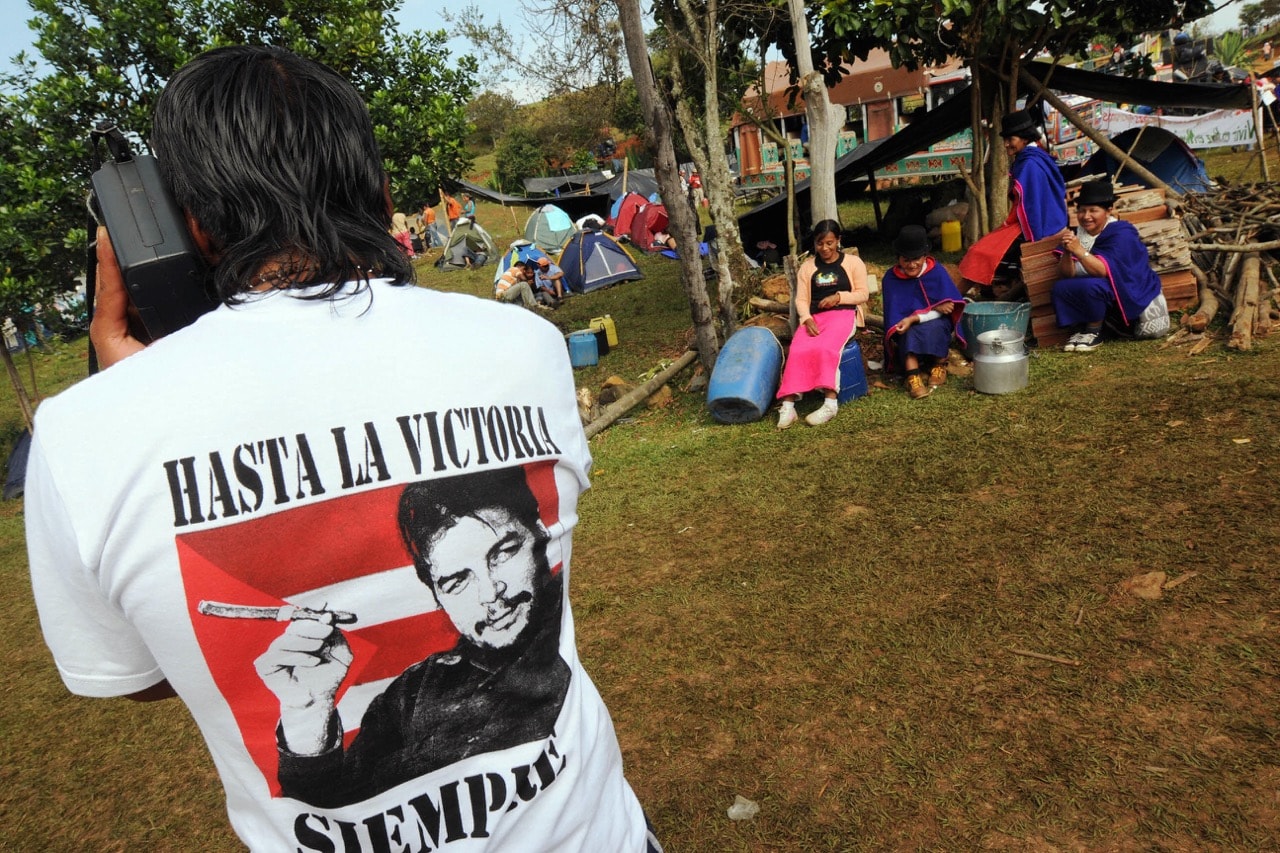 A Colombian indigenous man listens to the radio in Santander de Quilichao, in Valle del Cauca department, 22 October 2008, RODRIGO ARANGUA/AFP/Getty Images