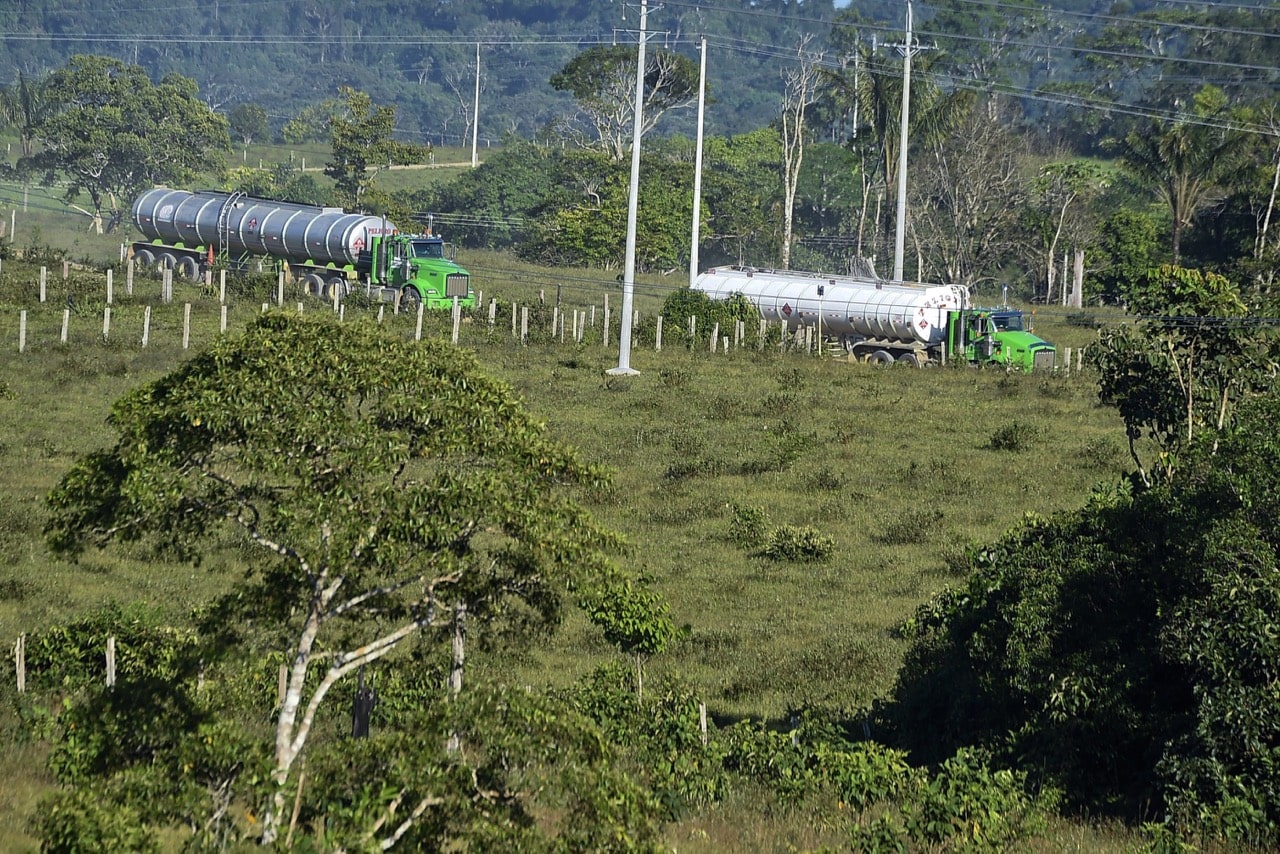 Two oil tankers in Los Pozos, department of Caquetá, Colombia, 3 November 2014; journalist Luis Antonio Peralta Cuéllar broadcast critical investigative reporting on local issues including the oil industry, LUIS ACOSTA/AFP/Getty Images