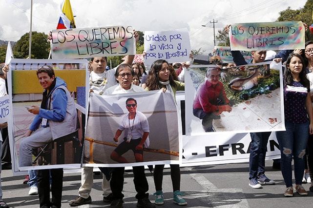 Relatives and friends of Javier Ortega, Paúl Rivas and Efraín Segarra demonstrate in Quito, April 1 2018., Cristina Vega/Getty Images