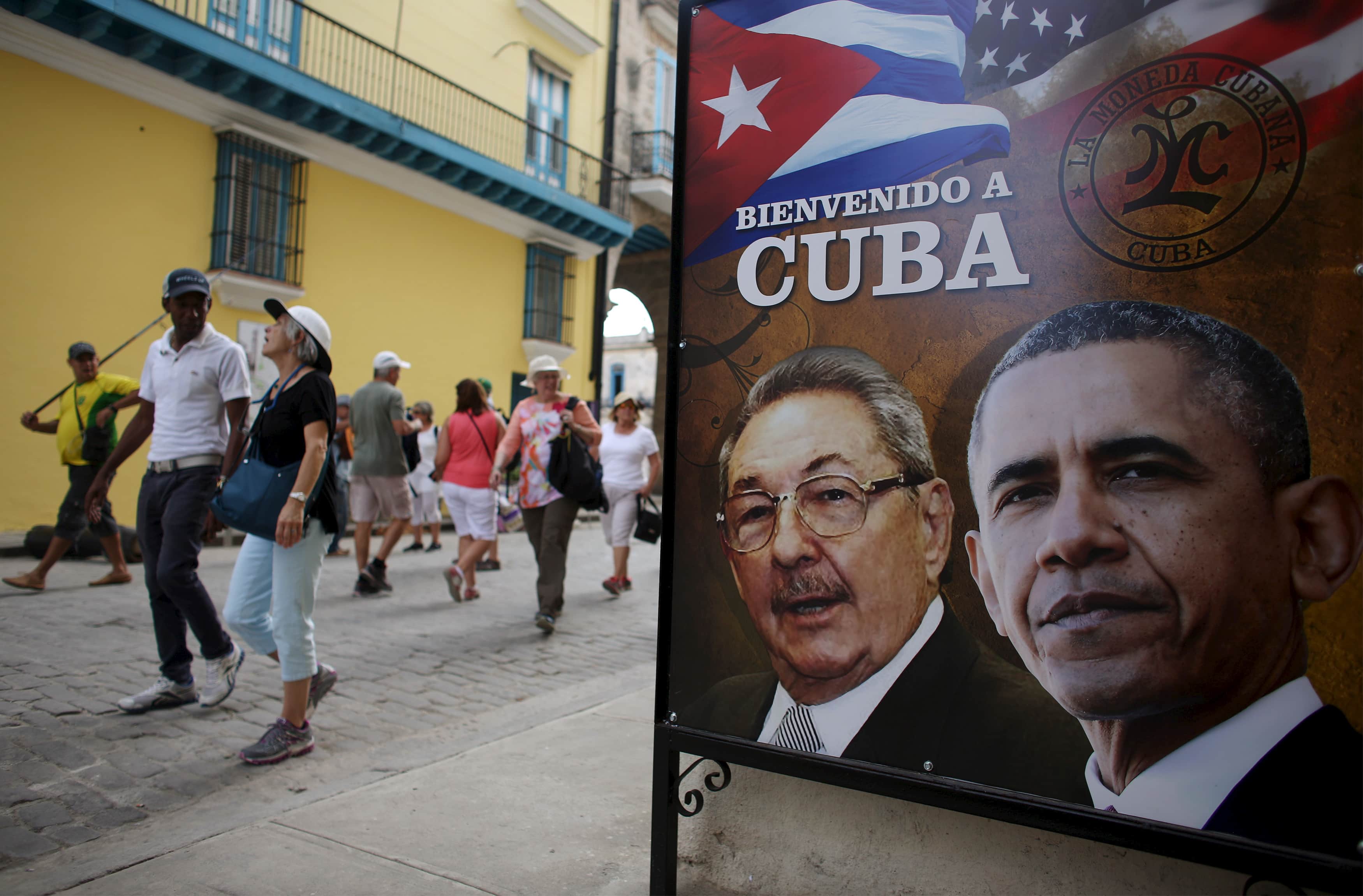 Poster in Havana shows images of Barack Obama and Raul Castro and reads "Welcome to Cuba" , REUTERS/Alexandre Meneghini