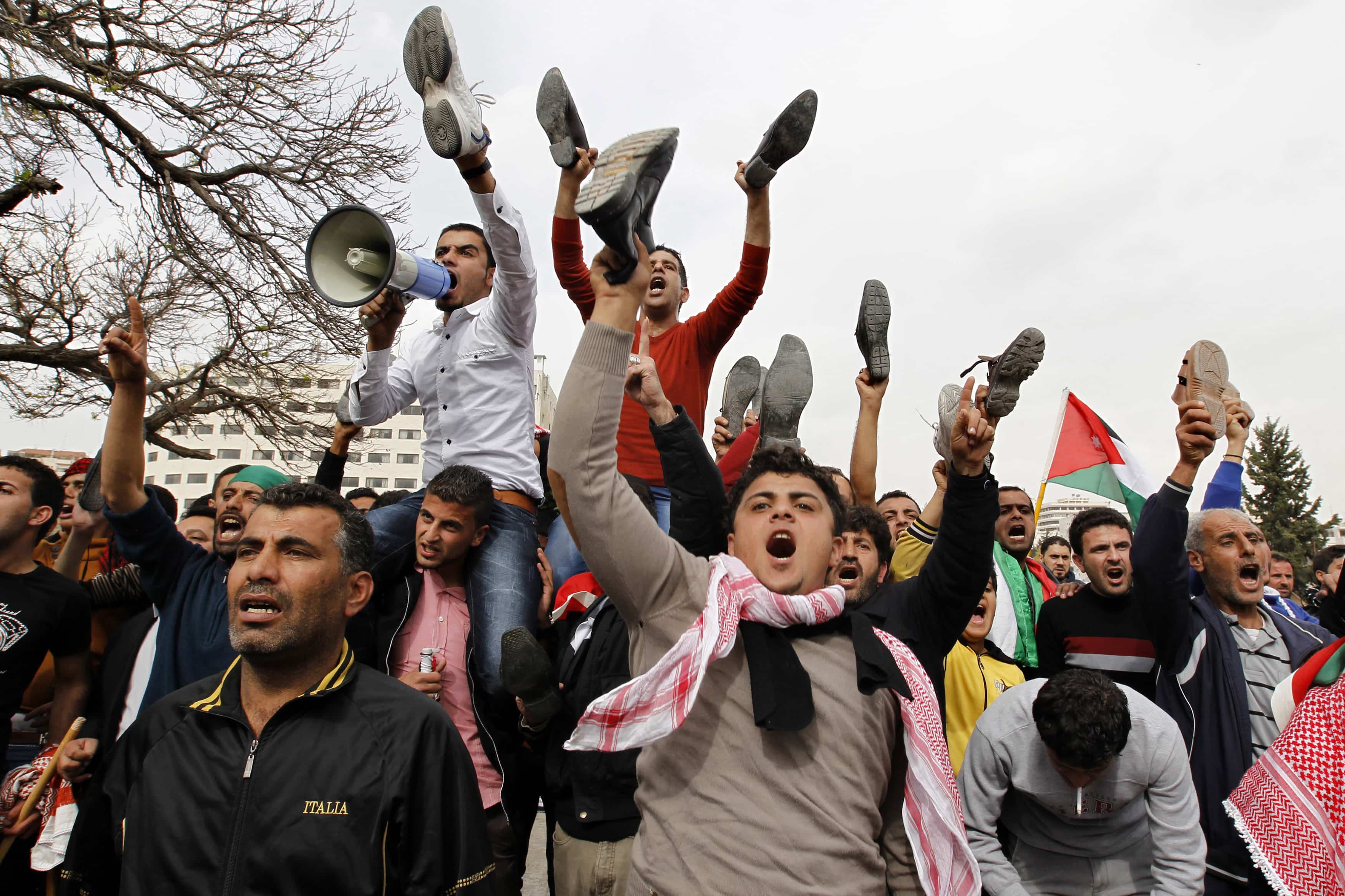 Relatives of Ahmed Dagamseh, a Jordanian soldier who was sentenced to life imprisonment in March 1997, and other activists shout slogans against the Israeli and Jordanian governments during a protest to demand his release in front of the Jordanian parliament in Amman on 18 March 2014, REUTERS/Muhammad Hamed