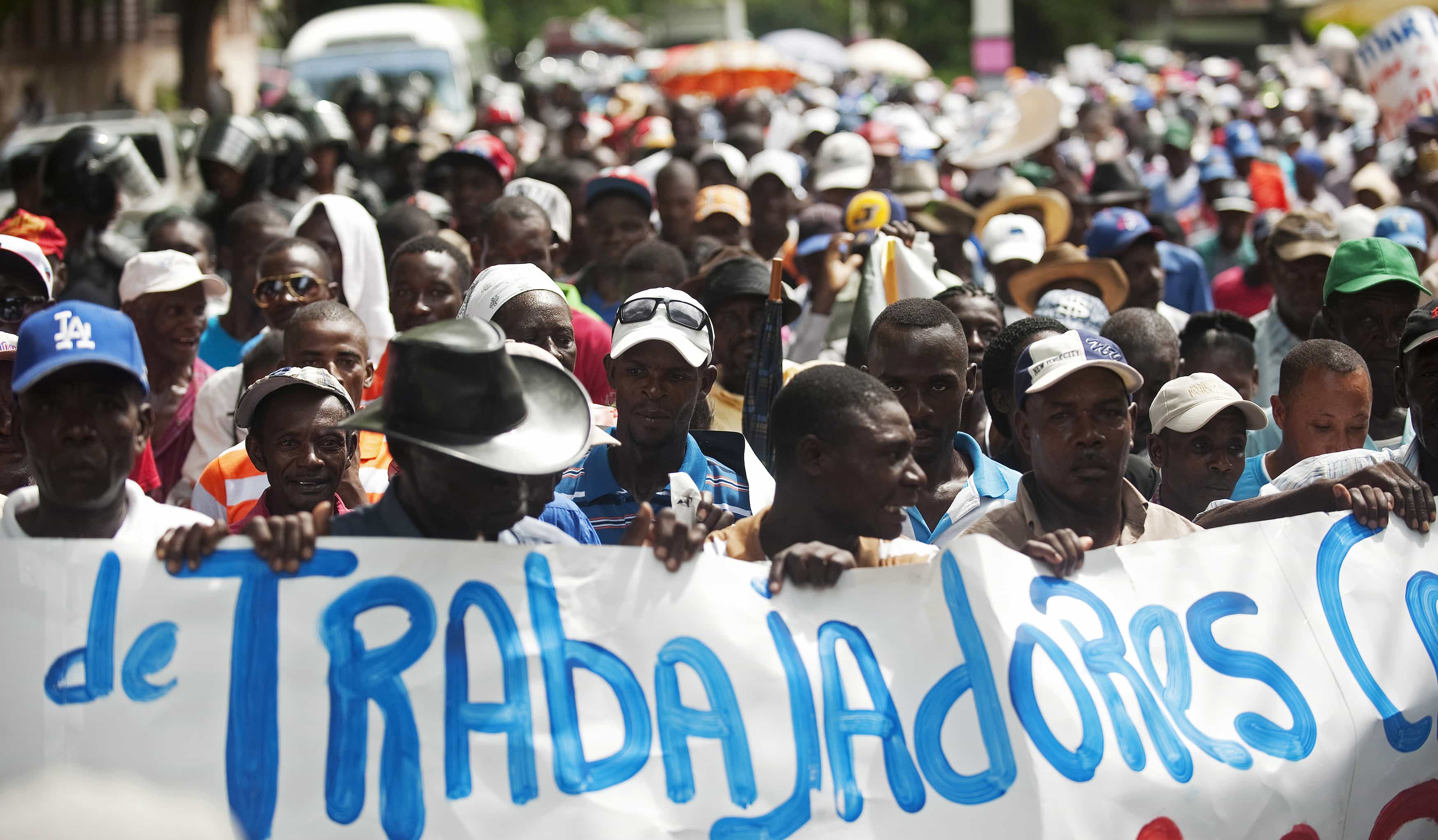 Haitian citizens who work on plantations in the Dominican Republic march towards their embassy to demand personal documents required by Dominican immigration for their applications for citizenship, REUTERS/Ricardo Rojas