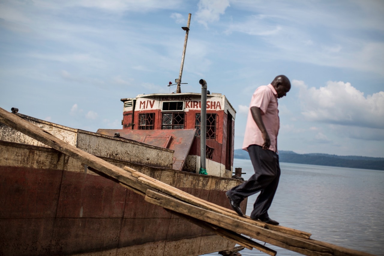 A man gets off a boat which was repaired in the port area of Bukavu, Democratic Republic of Congo, 31 March 2017 , GRIFF TAPPER/AFP/Getty Images