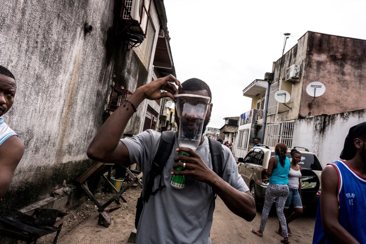 A Congolese man puts on an homemade gas mask during a protest called by the Catholic Church, to push for the President to step down, in Kinshasa, 25 February 2018, JOHN WESSELS/AFP/Getty Images