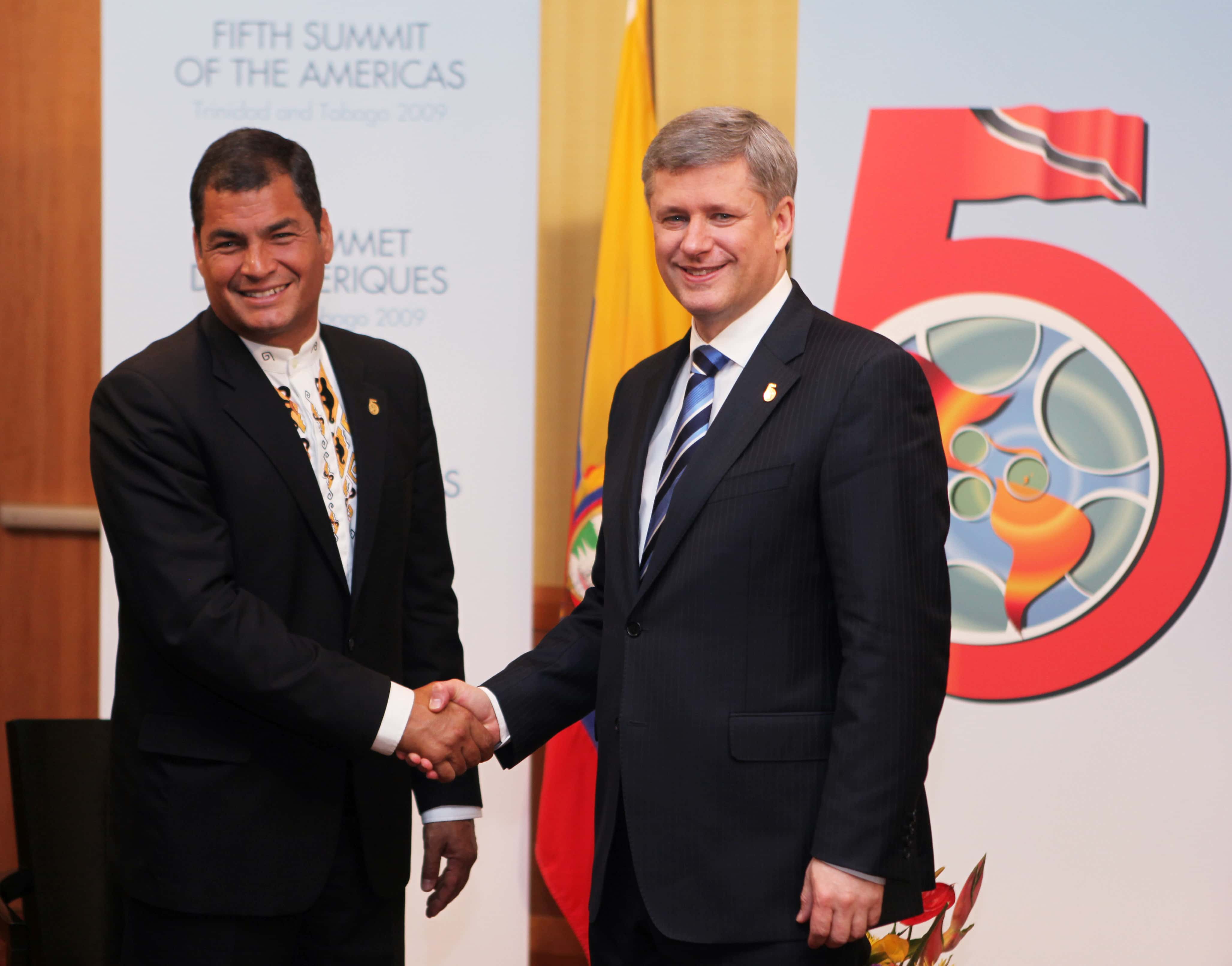 President Rafael Correa, left, shakes hands with Prime Minister Stephen Harper during the Summit of the Americas in Port of Spain, Trinidad and Tobago, 18 April 2009, AP Photo/Brennan Linsley