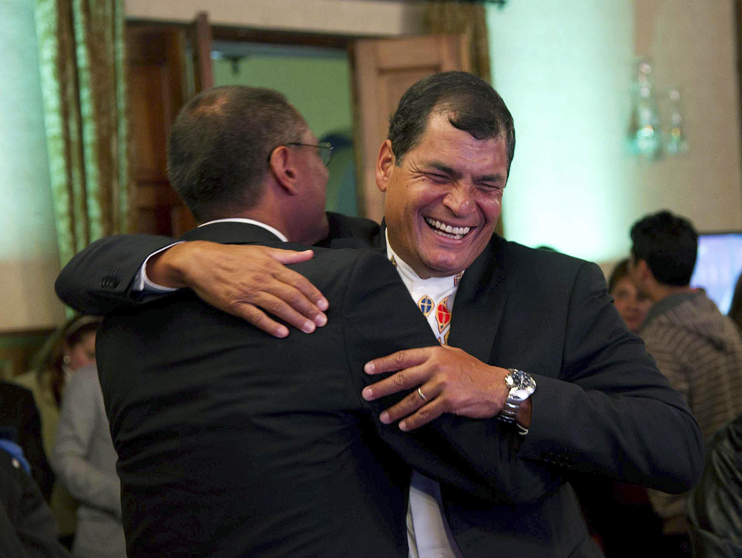 Ecuador's President Rafael Correa celebrates election victory with his Vice President-elect Jorge Glass, REUTERS/Gary Granja