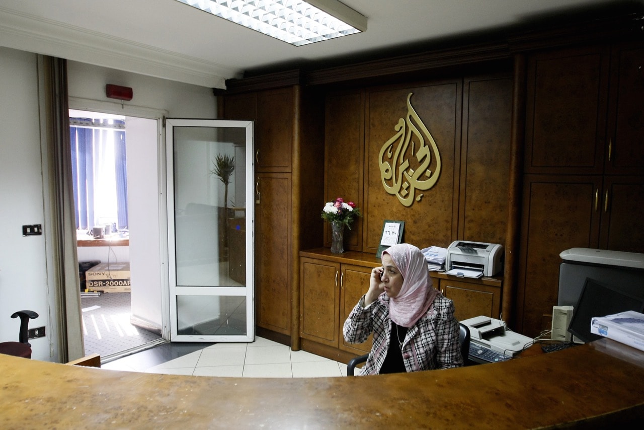 An Al-Jazeera employee talks on the phone at the TV channel's bureau in Cairo, Egypt, 30 January 2011, MOHAMMED ABED/AFP/GettyImages