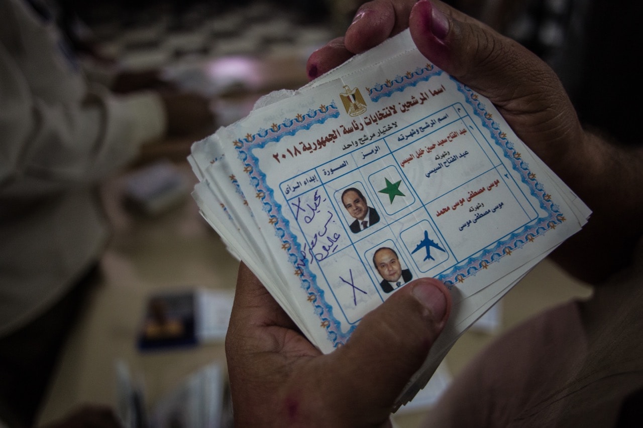 Electoral workers count ballots at the end of the final day of the Egyptian presidential election in Cairo, 28 March 2018, Fayed El-Geziry/NurPhoto via Getty Images