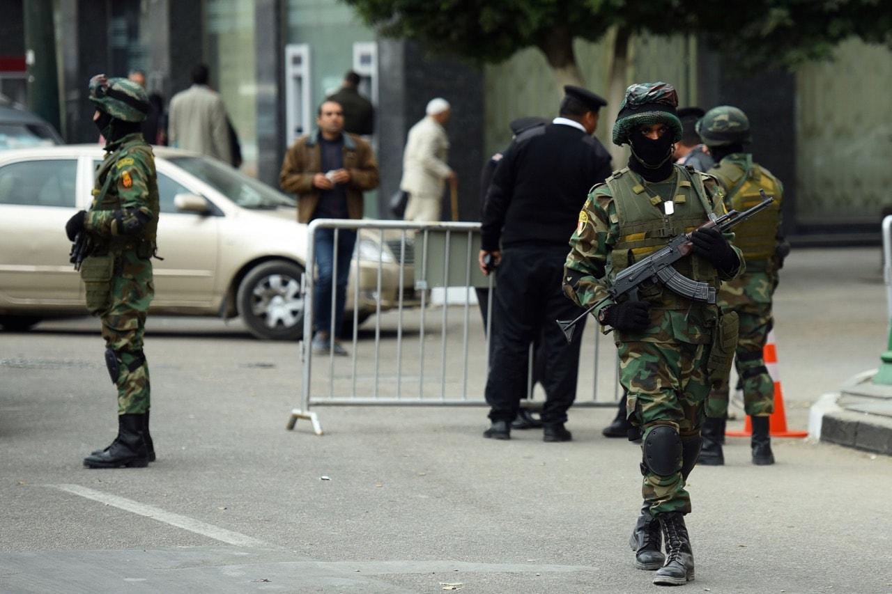 Egyptian special forces stand guard in front of the National Election Authority, in Cairo, 24 January 2018; Egyptian leader Abdel Fattah al-Sisi formally submitted his candidacy for presidential elections in March, MOHAMED EL-SHAHED/AFP/Getty Images