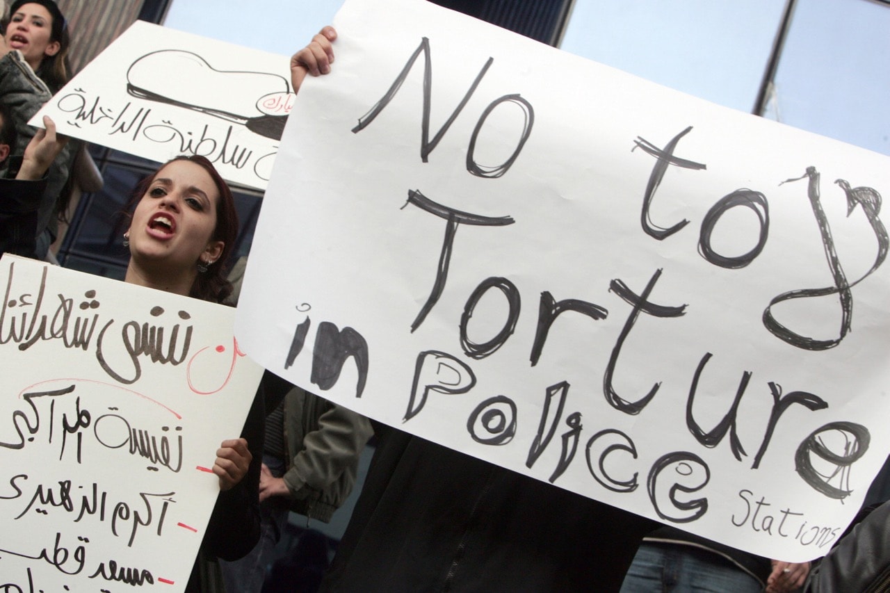 Egyptian human right activists protest against torture in police stations in Cairo, 25 January 2007, KHALED DESOUKI/AFP/Getty Images