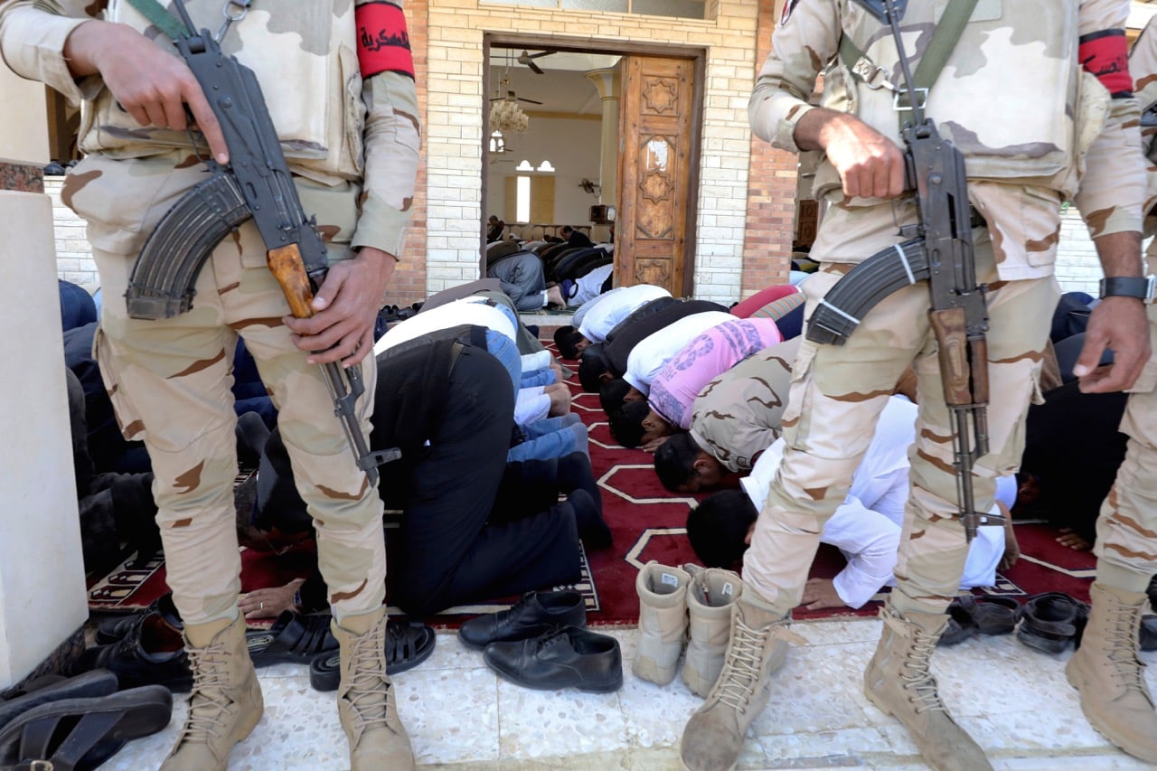 Military secure worshippers outside Al Rawdah mosque during the first Friday prayer after the attack in Bir Al-Abed, Egypt, 1 December 2017, REUTERS/Mohamed Abd El Ghany