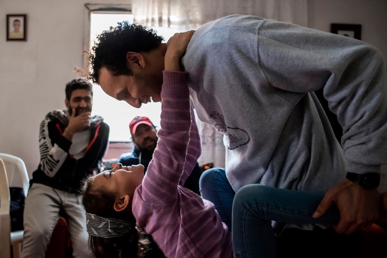 Egyptian photojournalist Mahmoud Abu Zeid, widely known as Shawkan, plays with his niece at his home in Cairo, 4 March 2019, KHALED DESOUKI/AFP/Getty Images