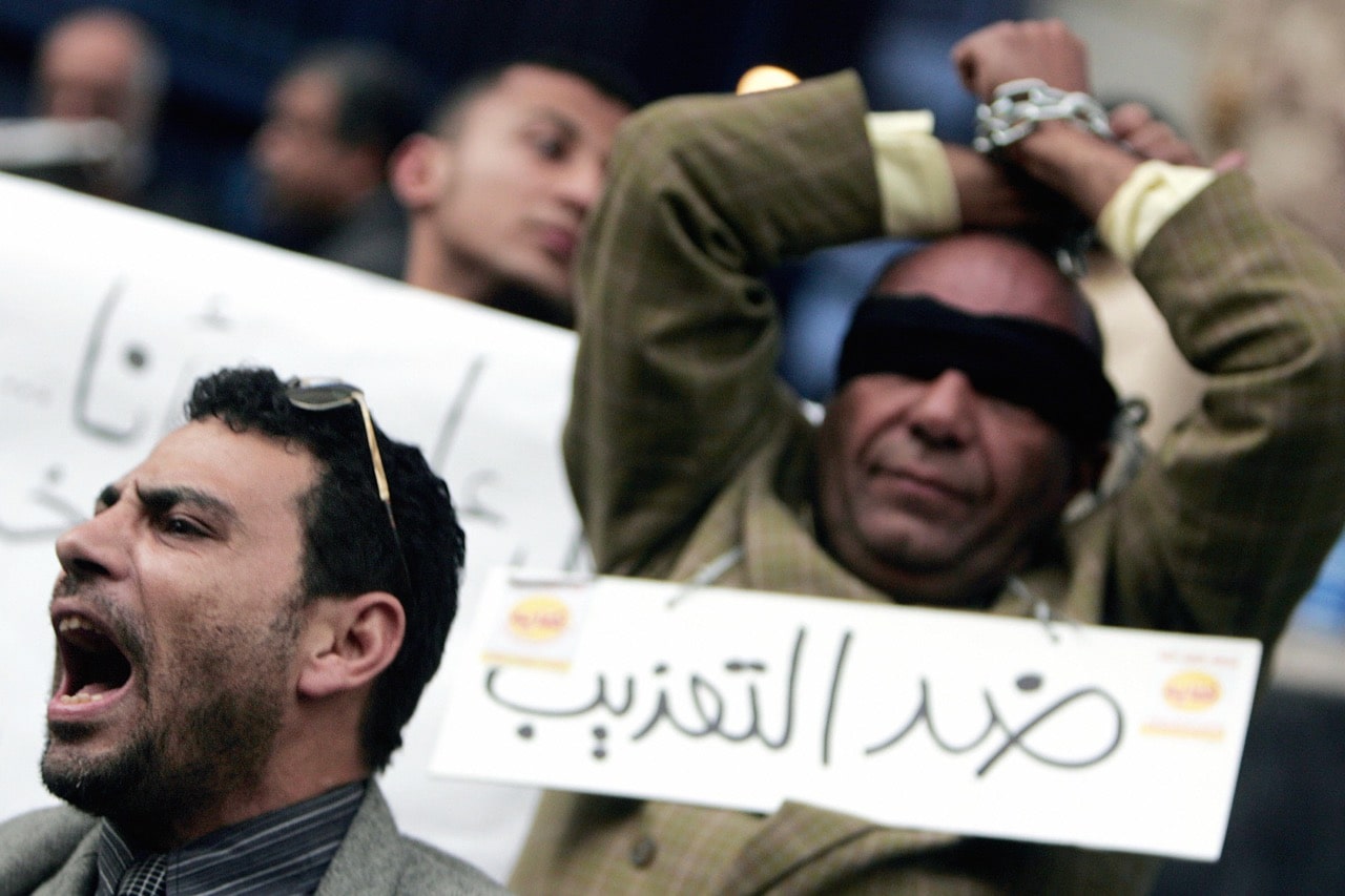 Egyptian human right activists protest against torture in police stations in Cairo, 25 January 2007, KHALED DESOUKI/AFP/Getty Images