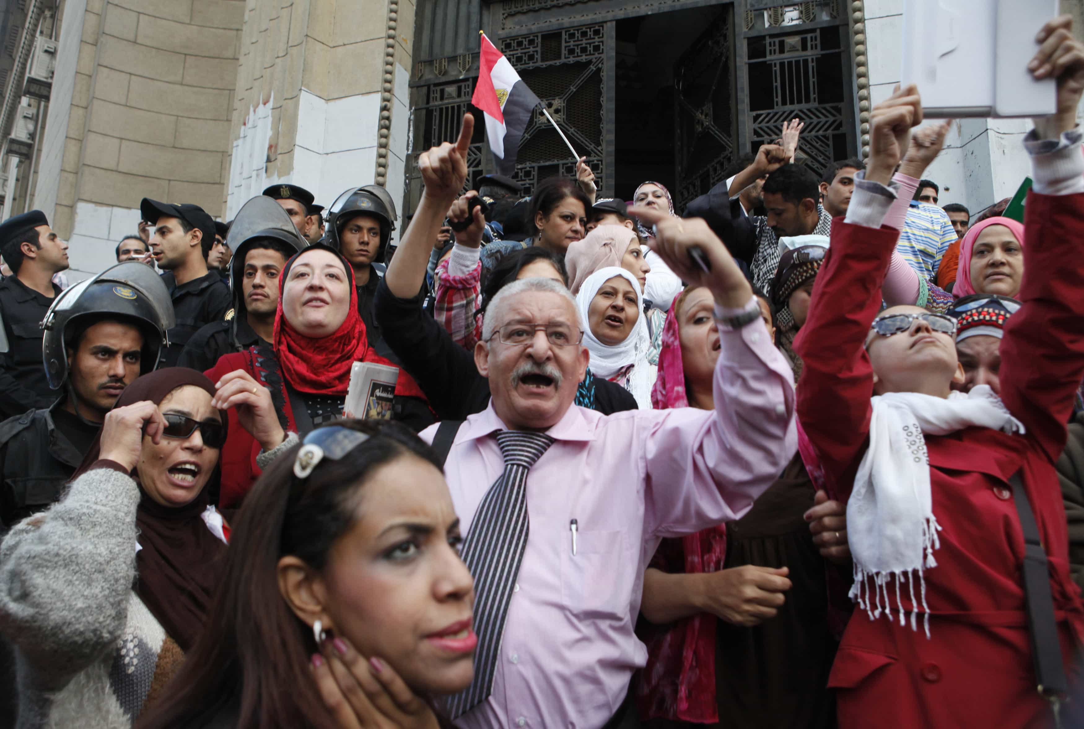 Anti-Morsi protesters chant slogans in front of the Supreme Judicial Council building in Cairo, on 24 November 2012, REUTERS/Asmaa Waguih