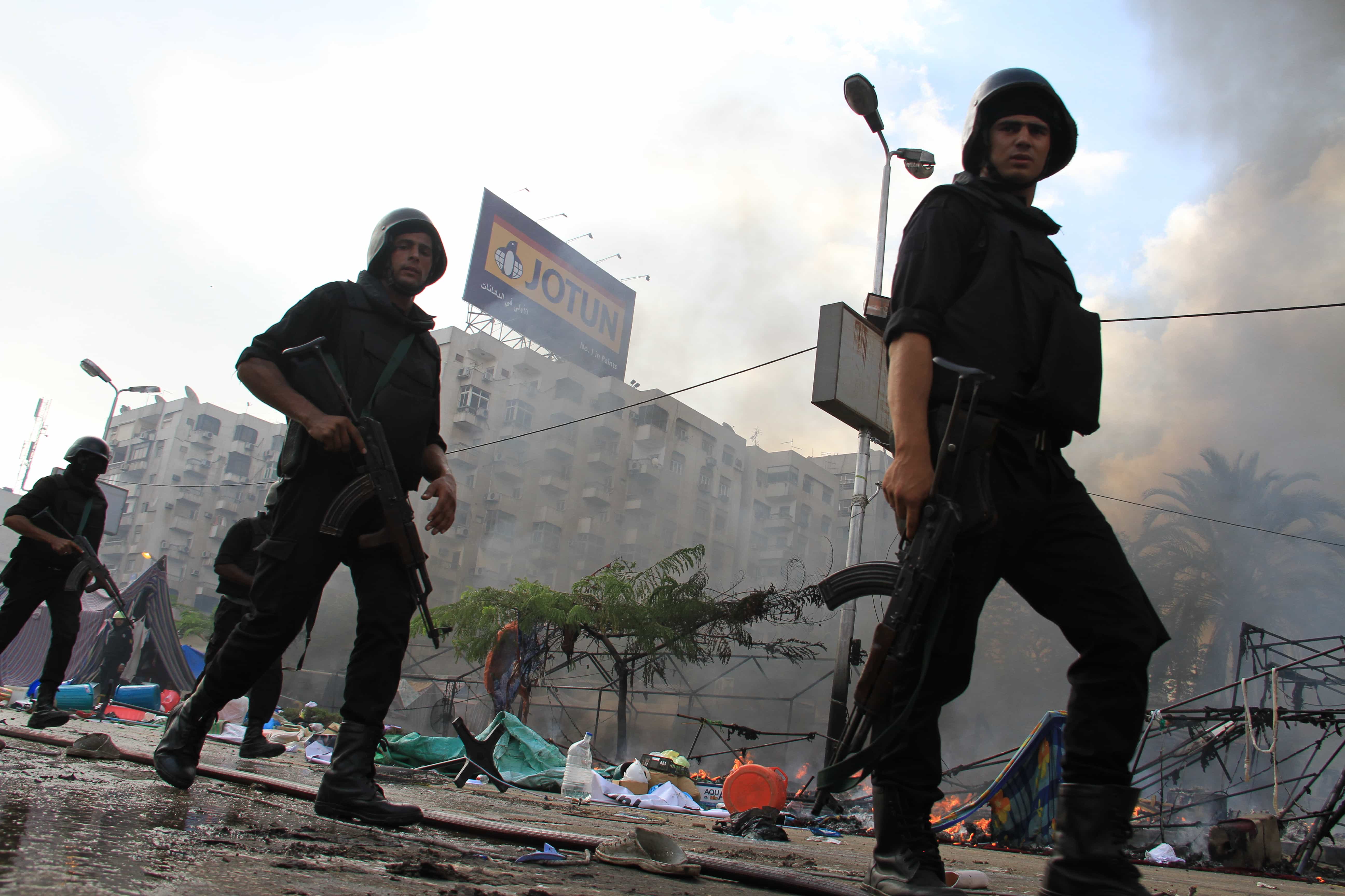 Egyptian security forces clear a sit-in by supporters of ousted Islamist President Mohammed Morsi in Cairo on 14 August 2013, AP Photo/Ahmed Gomaa