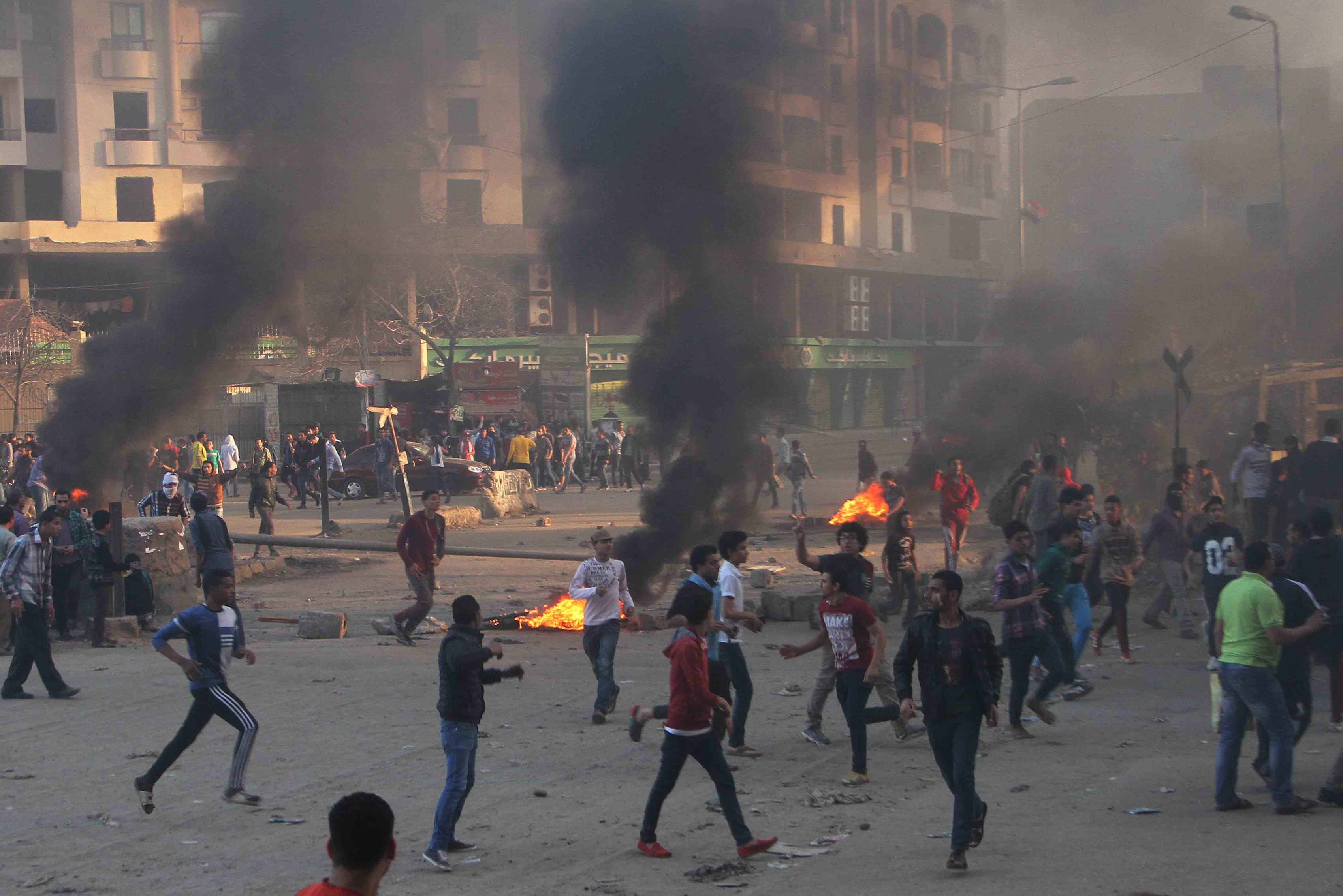 Protesters run during clashes with police in Ain Shams area east of Cairo March 28, 2014. At least three people were killed in clashes in Cairo on 28 March amid protests by the Muslim Brotherhood, REUTERS/Al Youm Al Saabi Newspaper