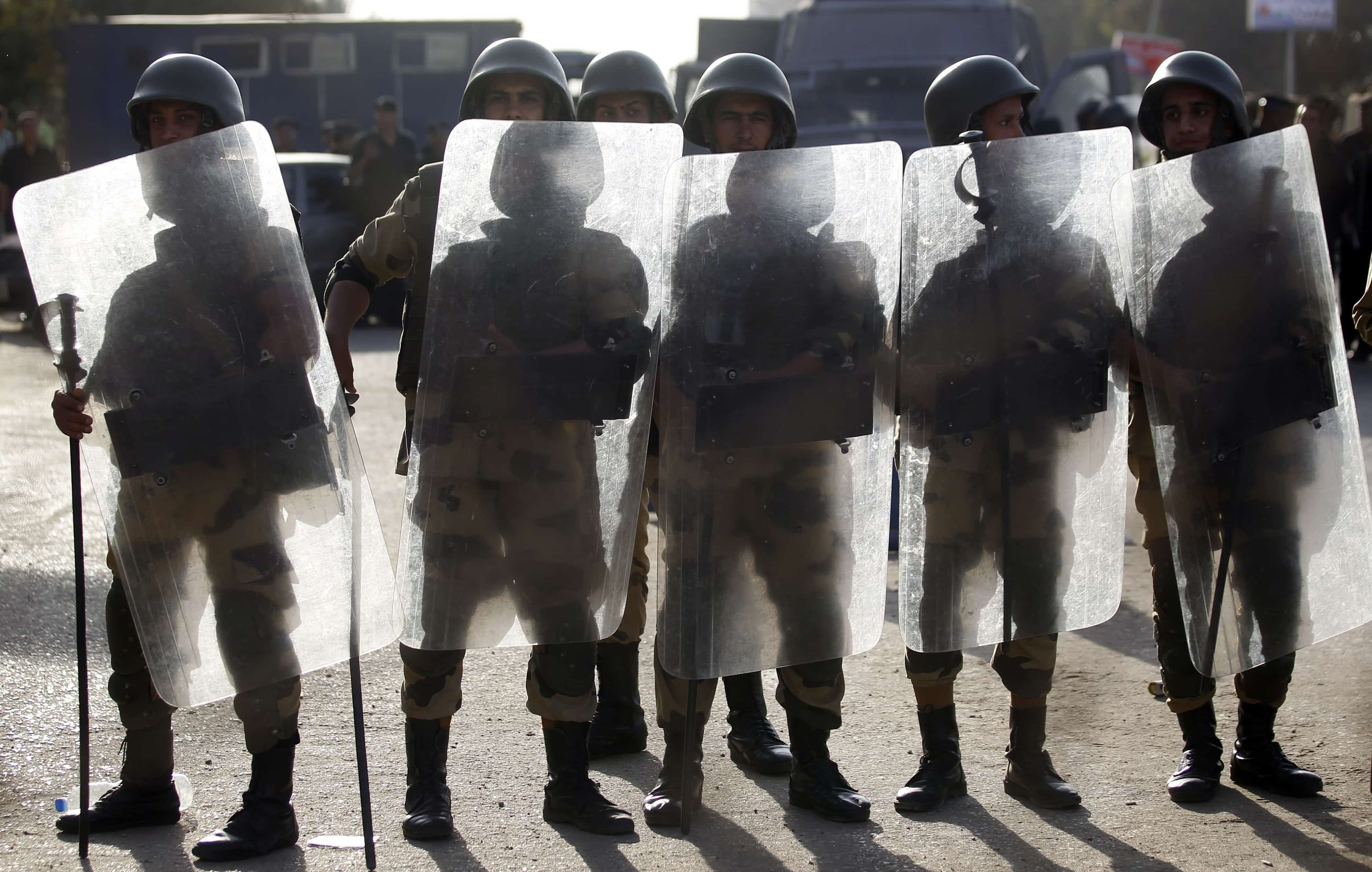 Egyptian soldiers stand guard during a protest by members and supporters of the Muslim Brotherhood in Cairo on 4 October 2013, REUTERS/Amr Abdallah Dalsh